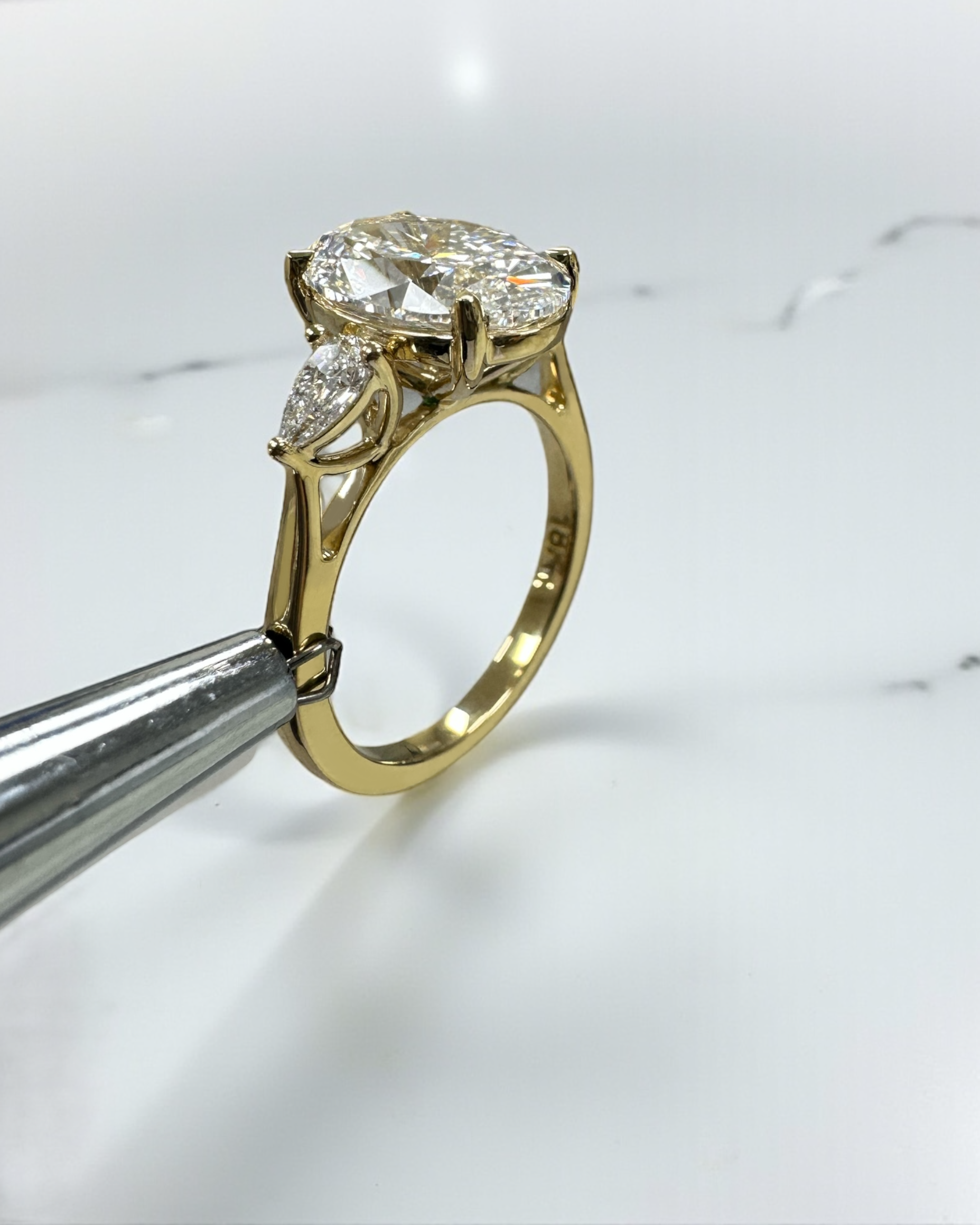 3.50ct Oval Cut Lab grown diamonds with Pear cut diamond trilogy engagement ring 18kt yellow gold
