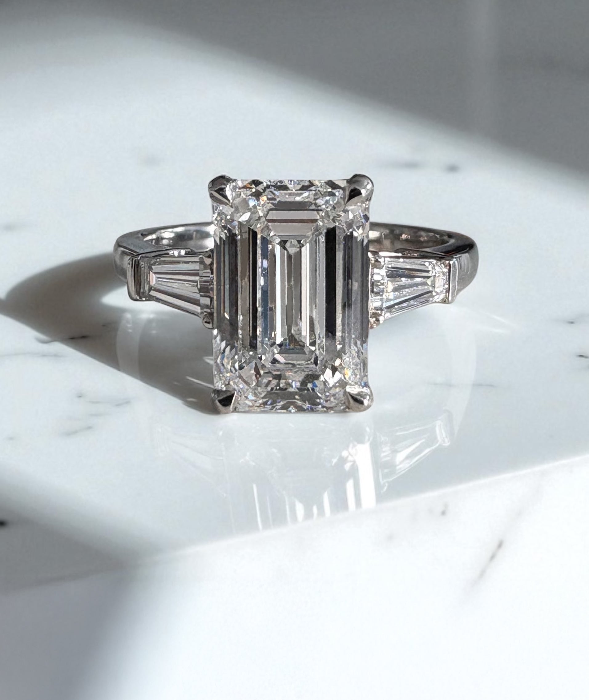 3ct Emerald Cut & Tapered Baguettes Trilogy diamond engagement rings.