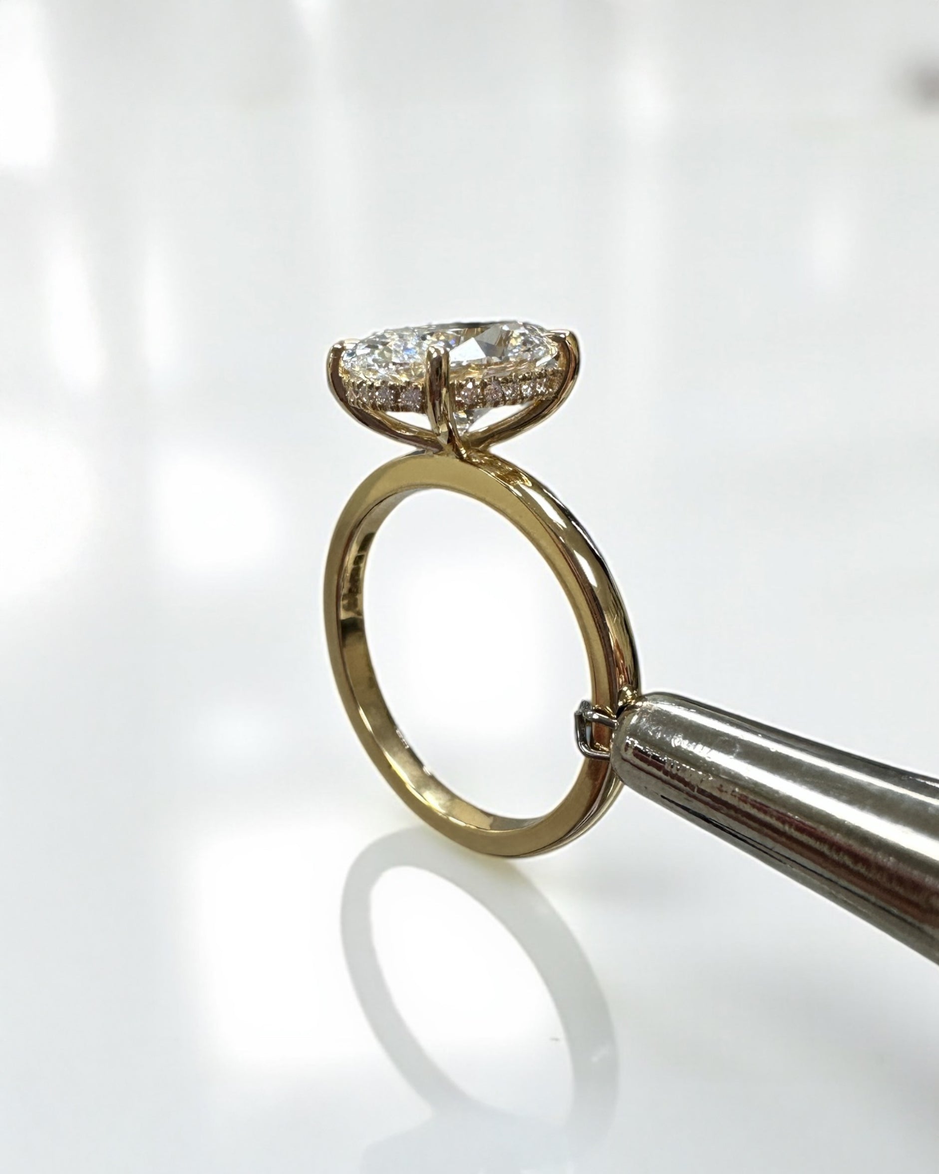3ct oval lab grown diamond hidden halo solitaire engagement ring in 18kt yellow gold, layla diamonds london