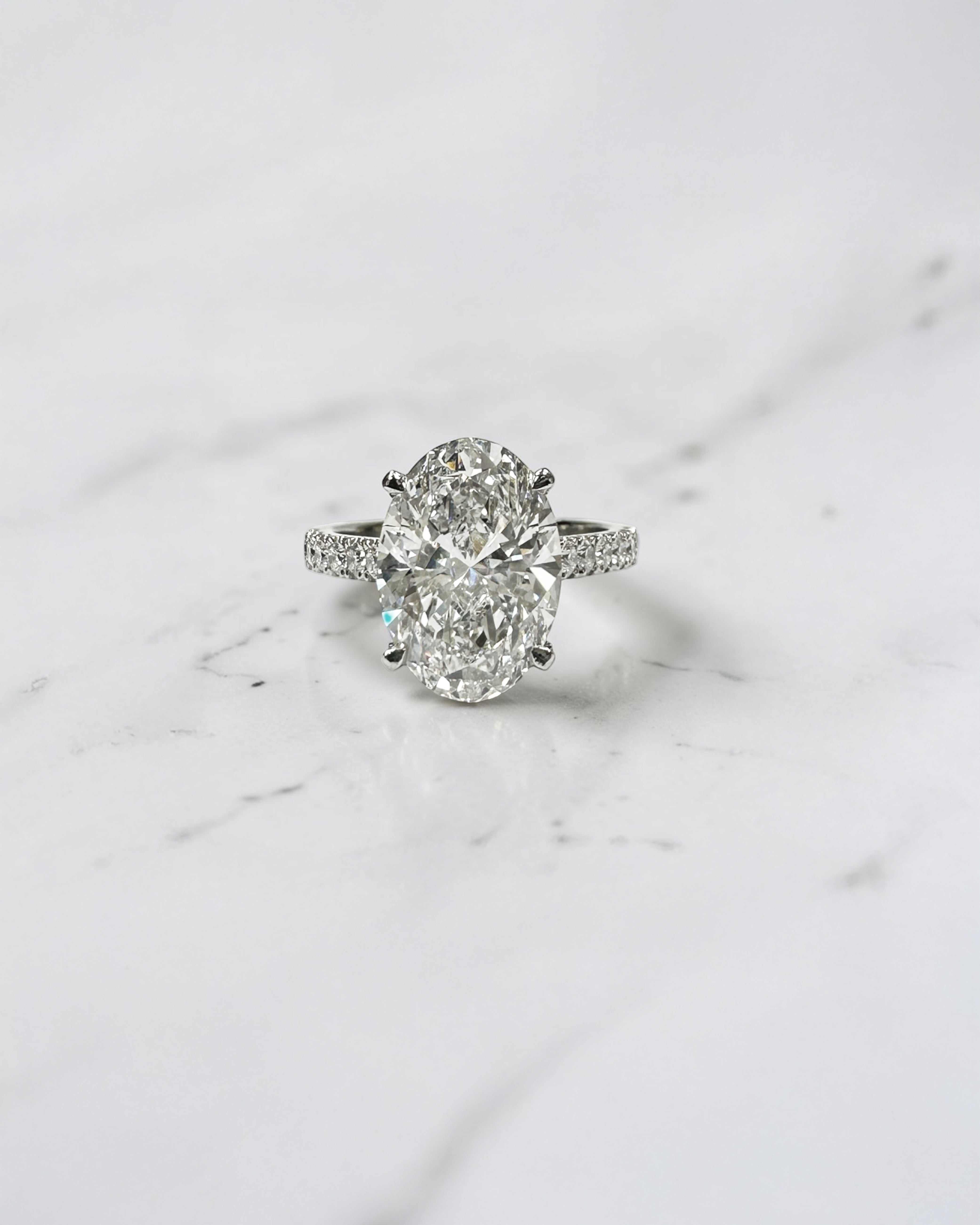 3ct Oval cut Cathedral Setting lab grown diamond engagement ring in platinum on hand