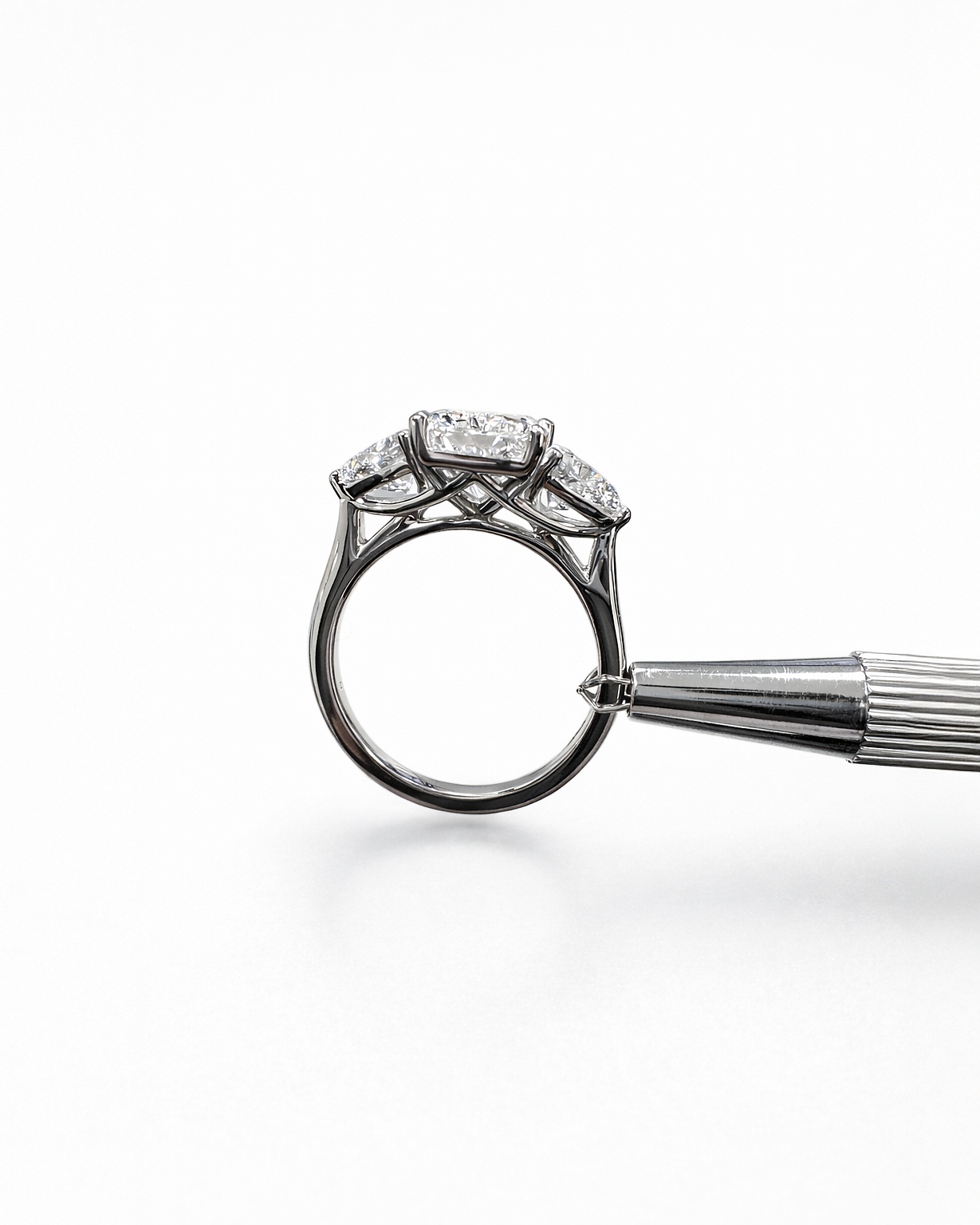 3ct radiant cut lab grown diamond engagement ring UK with trillion side stones, 4.40ct trilogy engagement ring design in polished white gold or platinum handcrafted in London