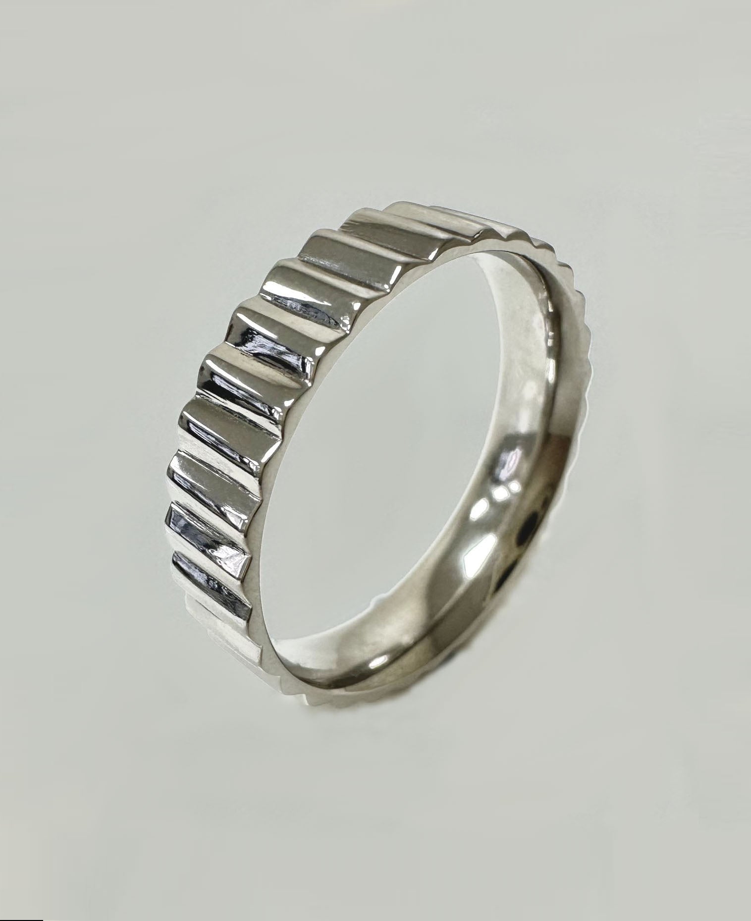 A striking 5mm polished fluted ring from our exclusive diamond wedding bands collection.
