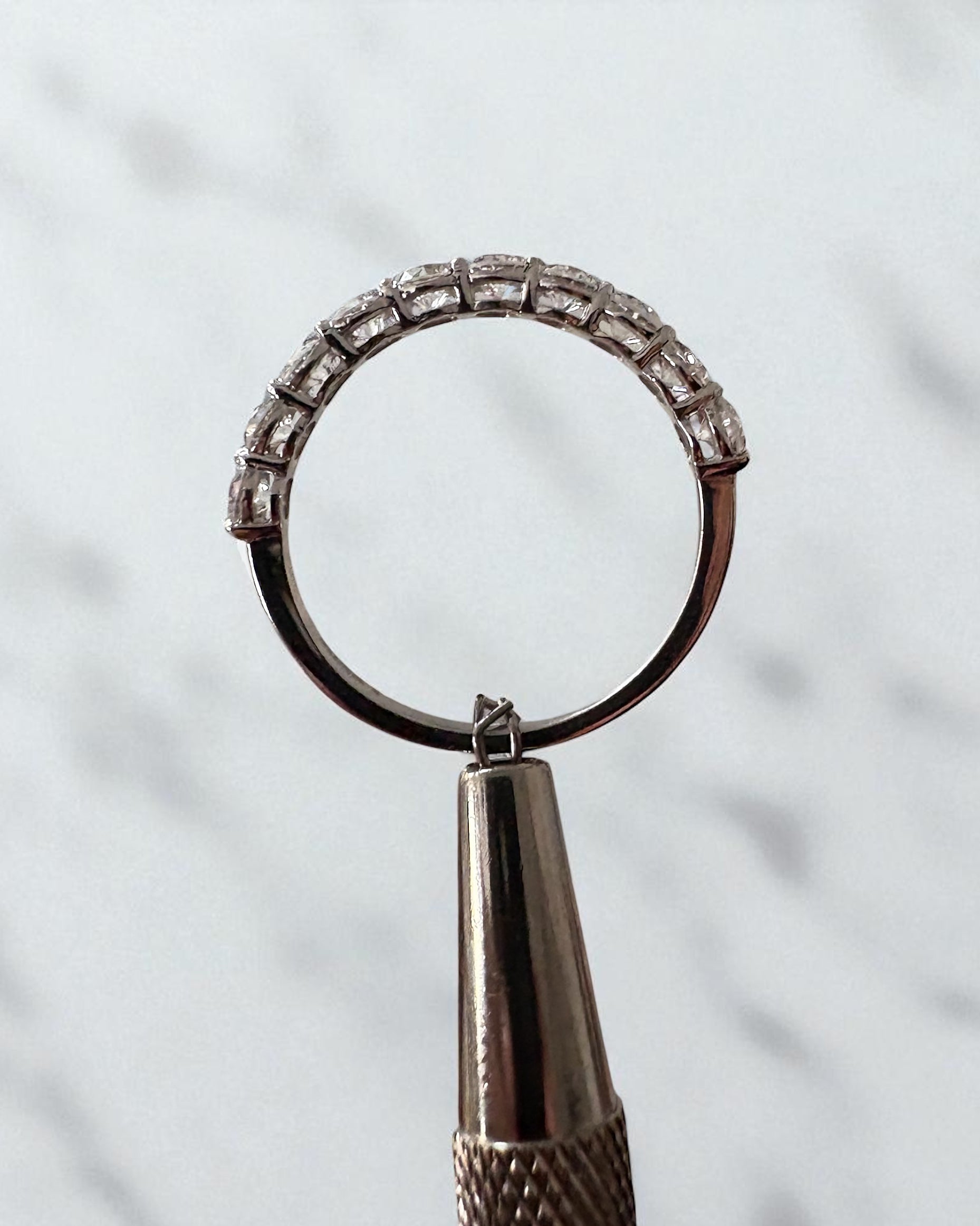 Side profile of the 1ct round diamond ring, part of our diamond wedding bands range.