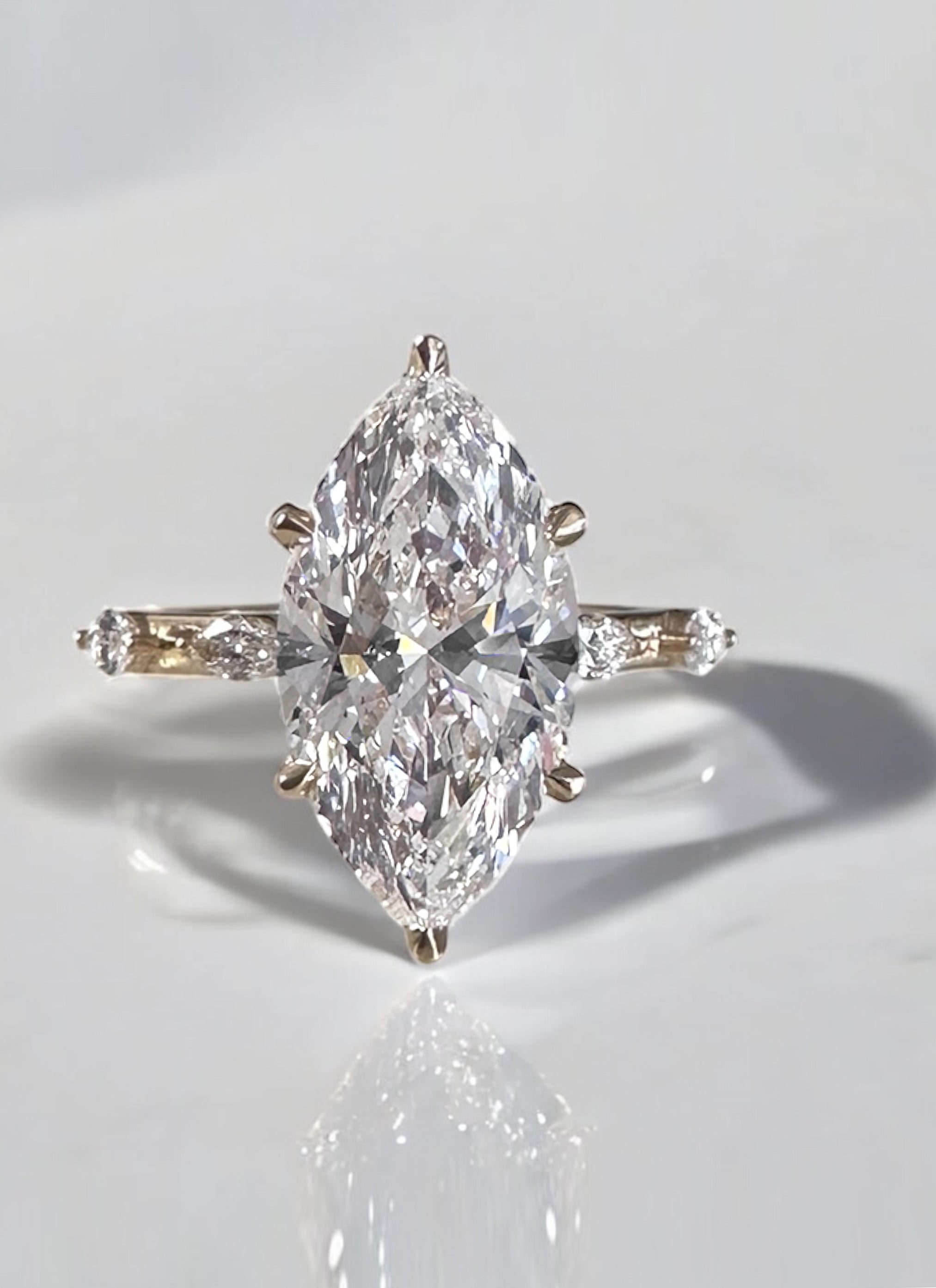 3.50ct marquise engagement ring with a unique spaced marquise diamond band.
