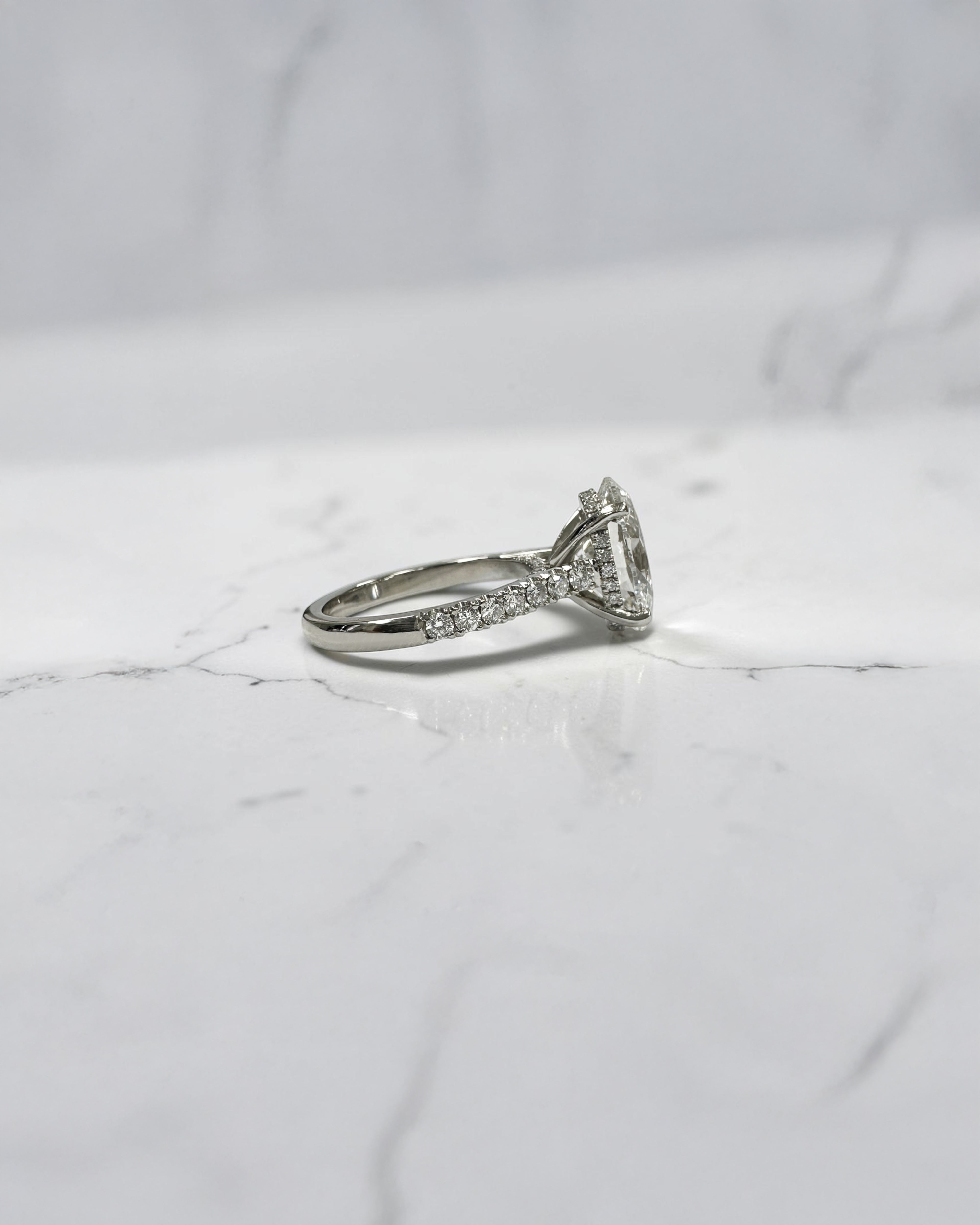 3ct Oval cut Cathedral Setting lab grown diamond engagement ring in platinum on hand