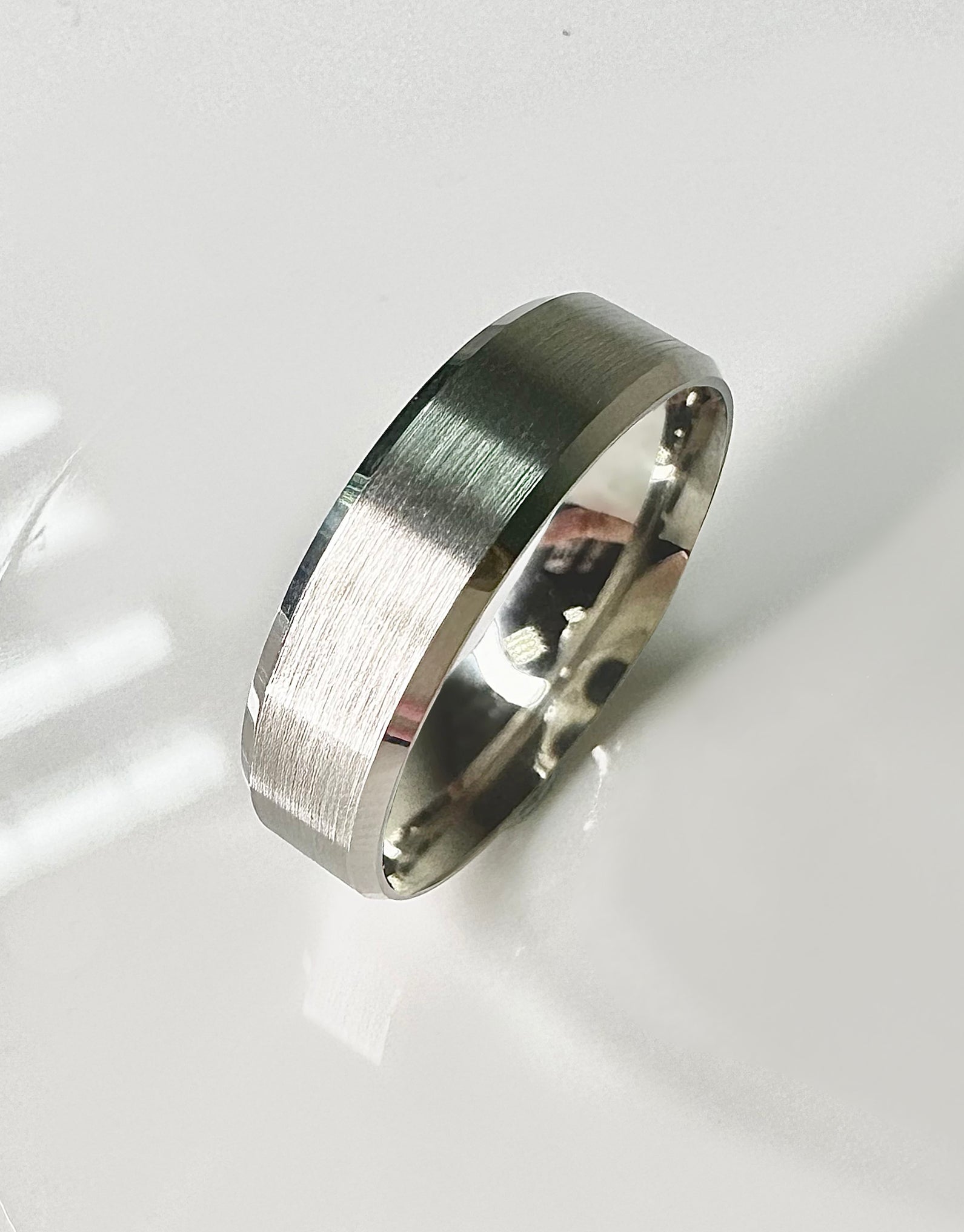 A contemporary 6mm bevelled edge matt finish ring from our wedding band for him collection.