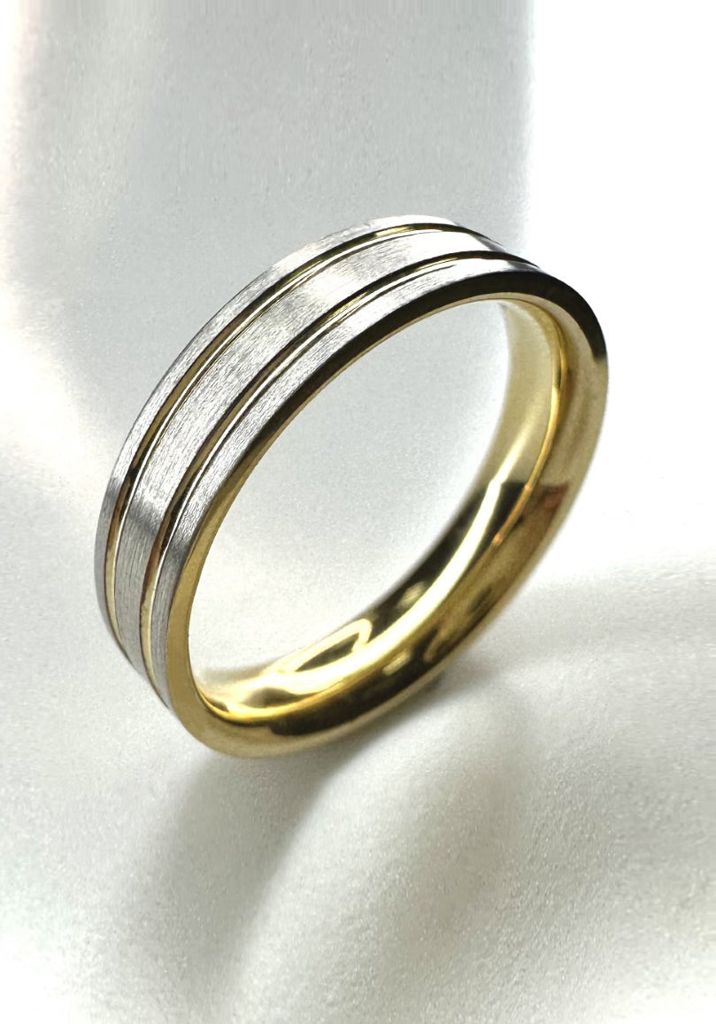 A contemporary 5mm two-tone flat court ring with a center groove from our male engagement band collection.