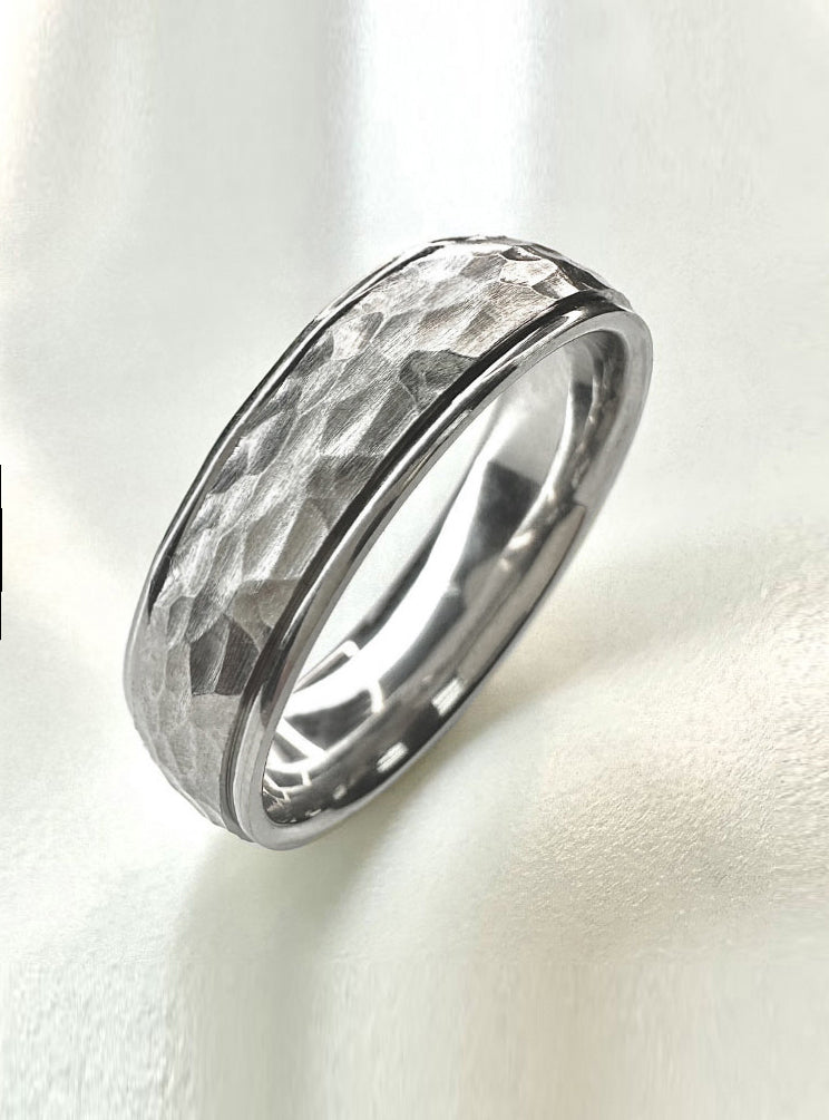 A distinctive 6mm hammered court profile ring from our premium male engagement band collection.