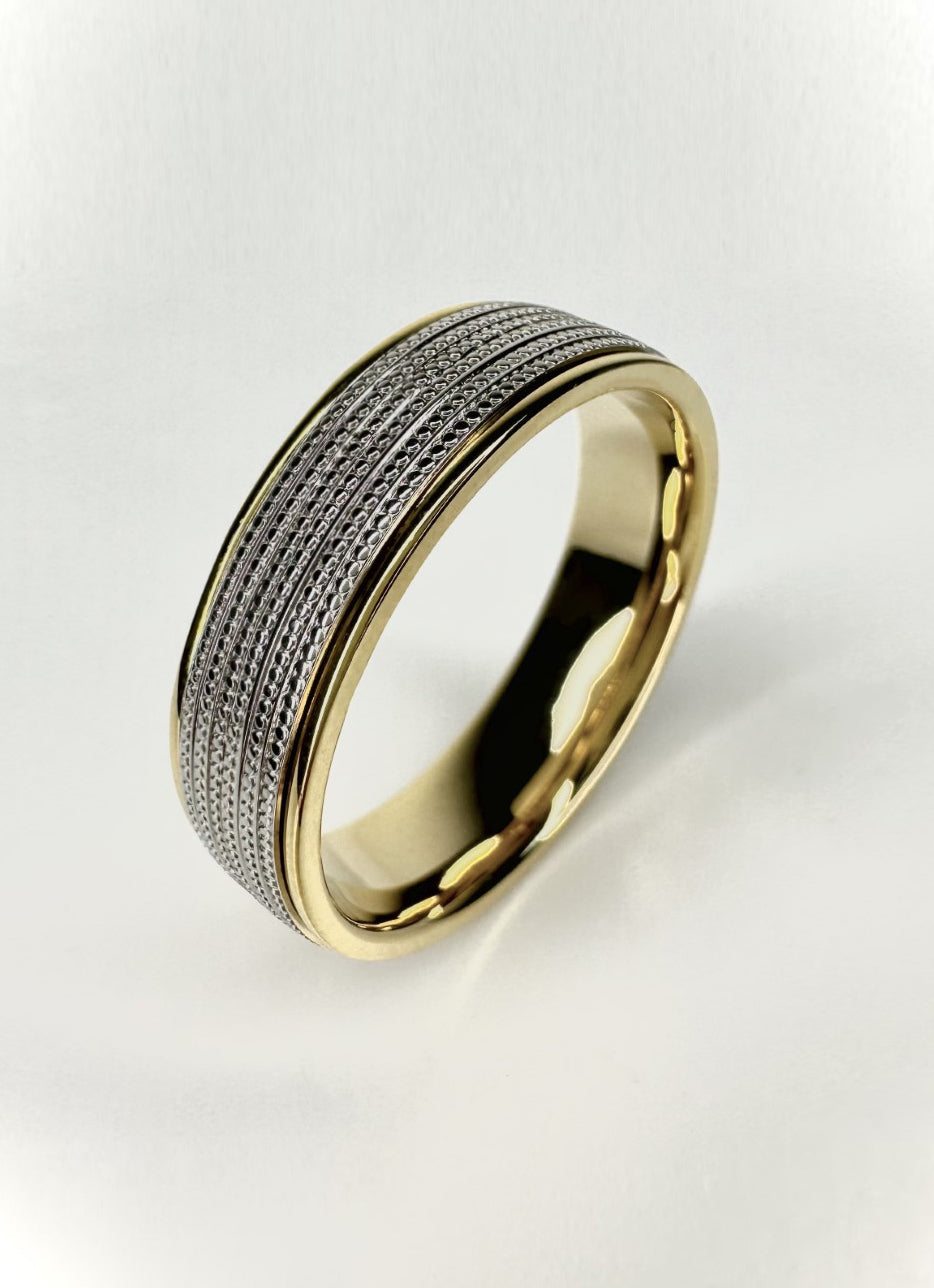 A striking 6mm two-colour flat court ring with detailed milgrain edges from our premium male engagement bands collection.
