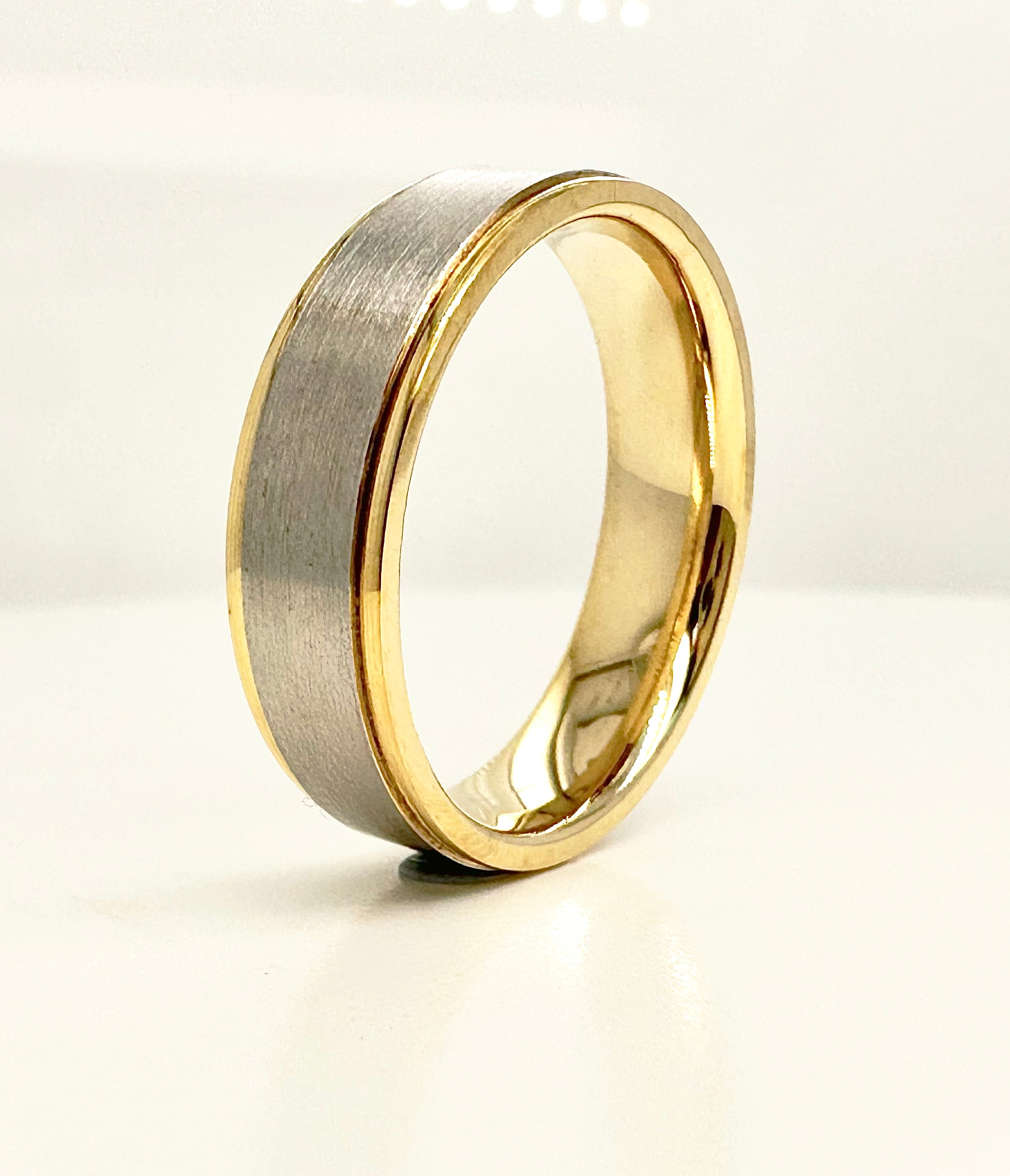 A contemporary 6mm two-tone flat court ring from our premium male engagement bands collection.