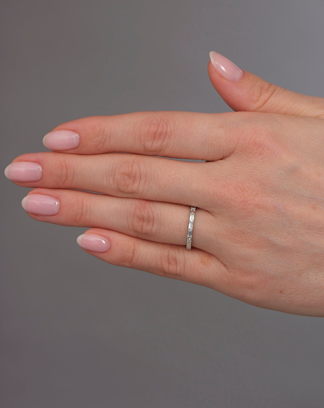 Close-up detail of the baguette cut diamonds on this elegant wedding bands for women style.