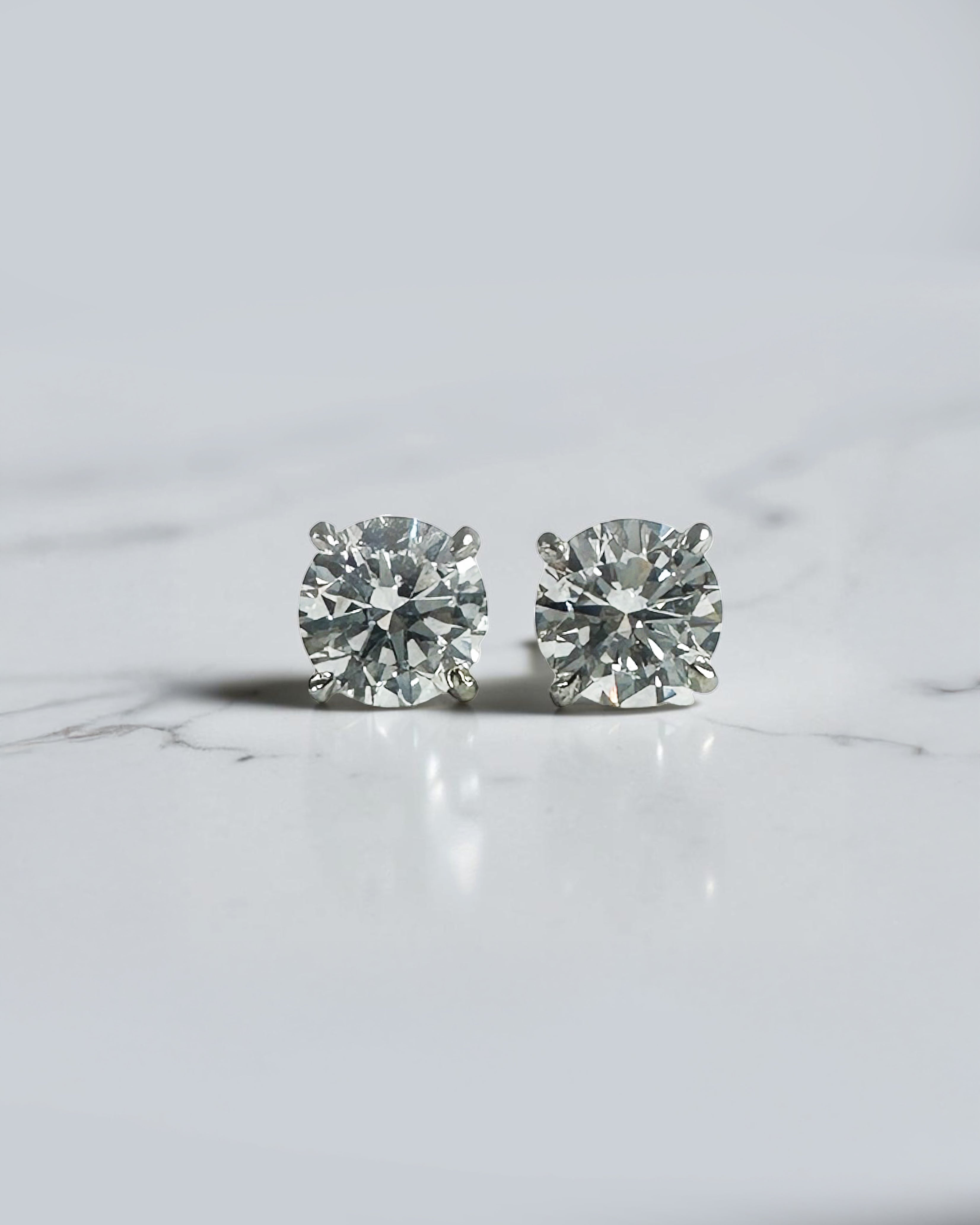 0.50ct round brilliant lab grown diamond martini stud earrings in a four prong setting handcrafted in white gold by Layla Diamonds