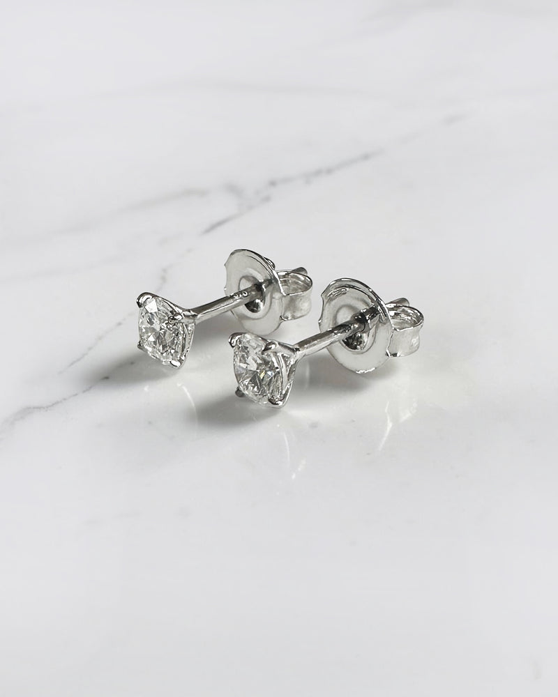 0.50ct round brilliant lab grown diamond martini stud earrings in a four prong setting handcrafted in white gold by Layla Diamonds