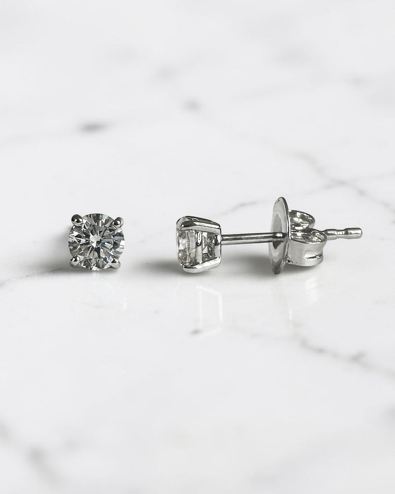 0.50ct round brilliant lab grown diamond stud earrings in a classic four claw setting with minimum E/F colour and VS1 clarity by Layla Diamonds.