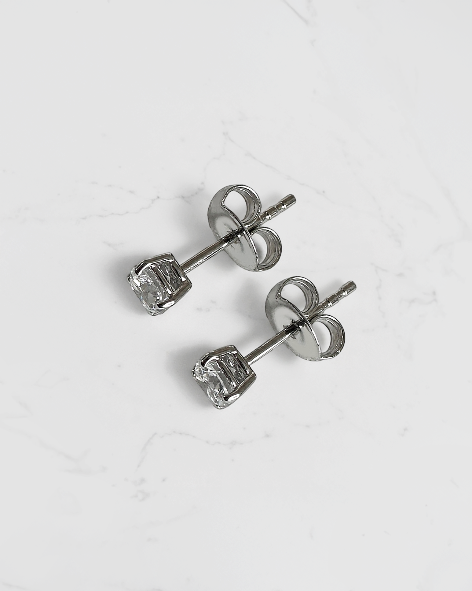 0.50ct round brilliant lab grown diamond stud earrings in a classic four claw setting with minimum E/F colour and VS1 clarity by Layla Diamonds.