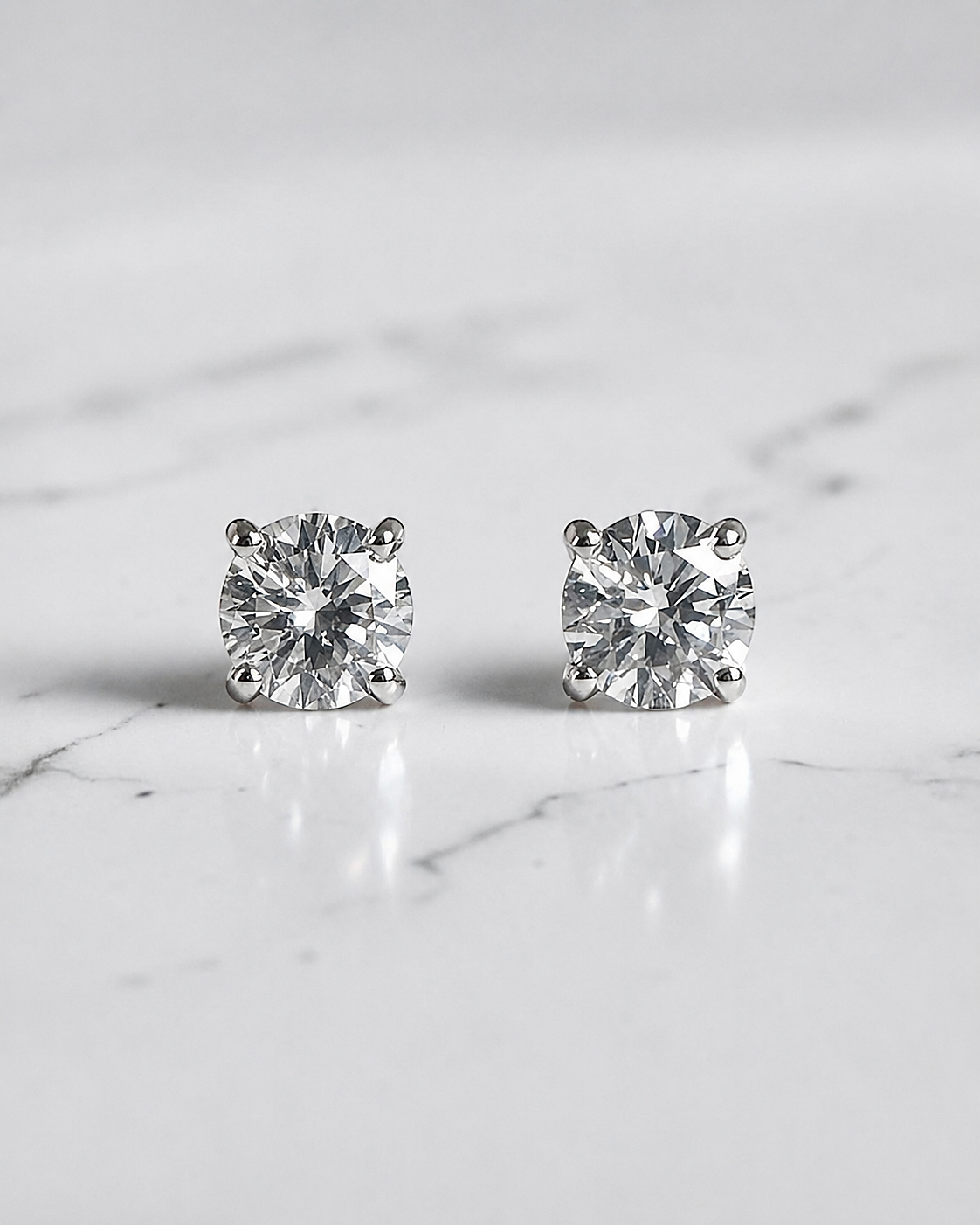 0.50ct round brilliant lab grown diamond stud earrings in a classic four claw setting with minimum E/F colour and VS1 clarity by Layla Diamonds.