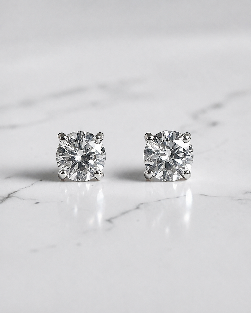 0.50ct round brilliant lab grown diamond stud earrings in a classic four claw setting with minimum E/F colour and VS1 clarity by Layla Diamonds.