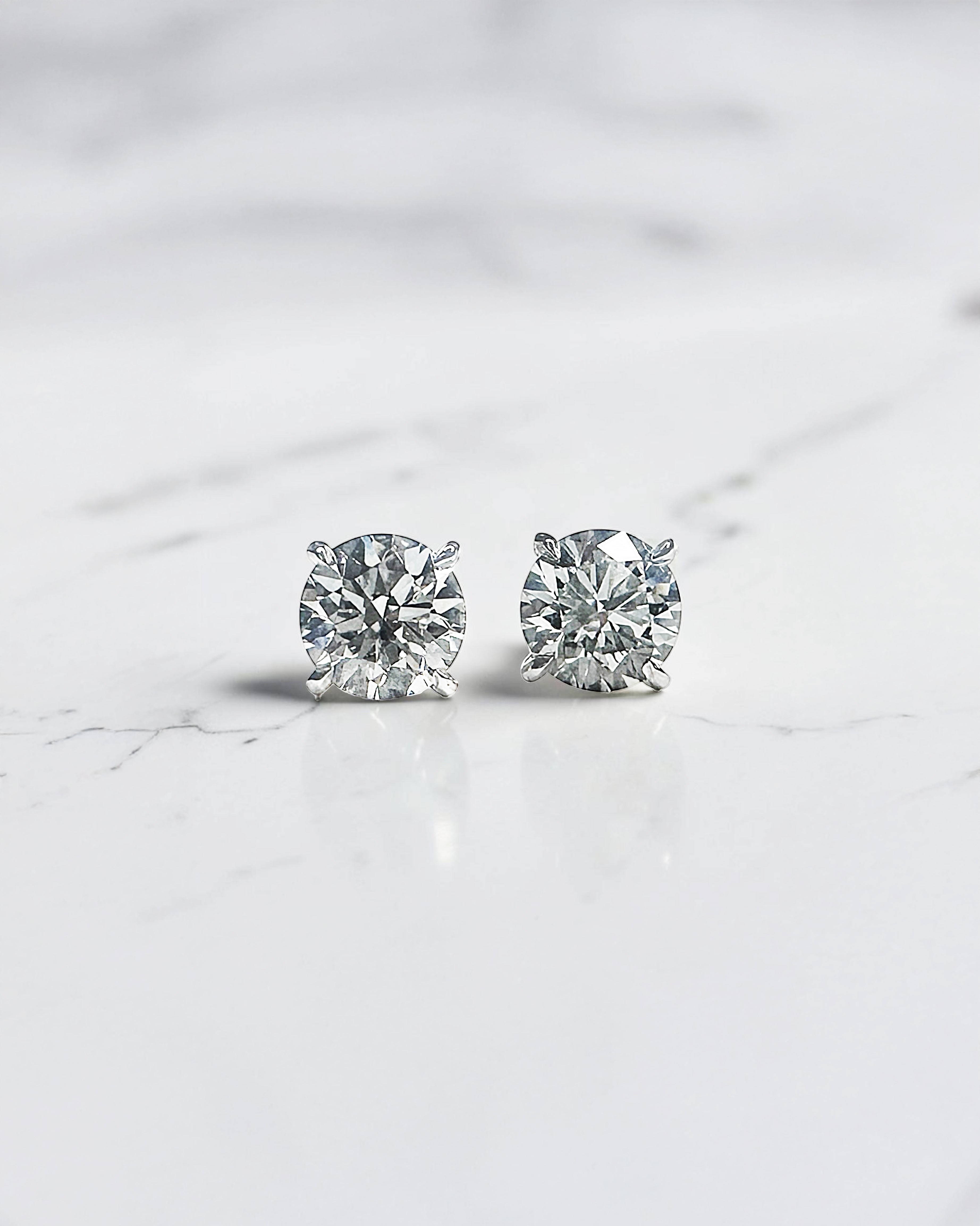 0.50ct round brilliant lab grown diamond martini stud earrings in a four prong setting handcrafted in white gold by Layla Diamonds