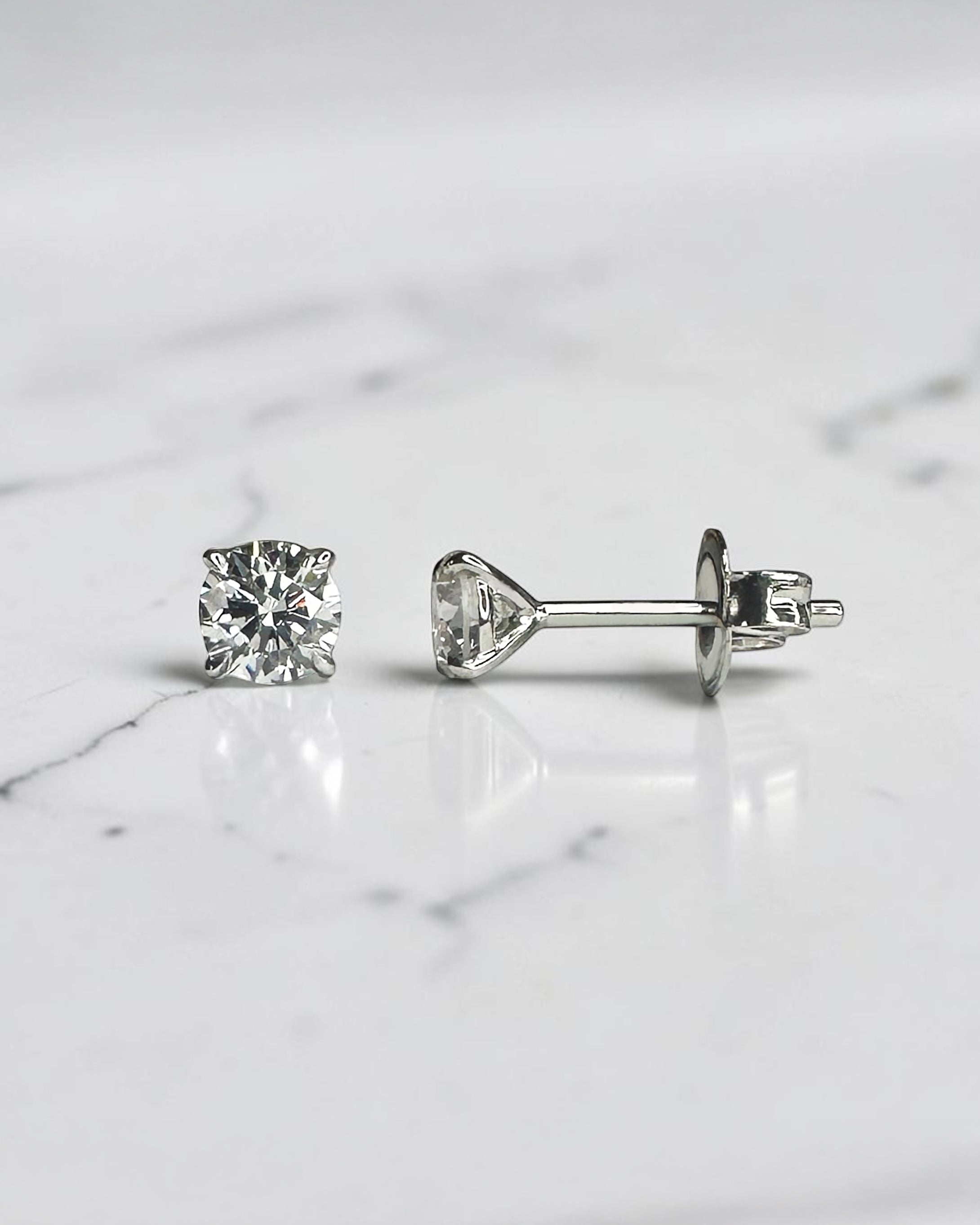 0.50ct round brilliant lab grown diamond martini stud earrings in a four prong setting handcrafted in white gold by Layla Diamonds