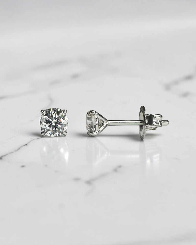 0.50ct round brilliant lab grown diamond martini stud earrings in a four prong setting handcrafted in white gold by Layla Diamonds