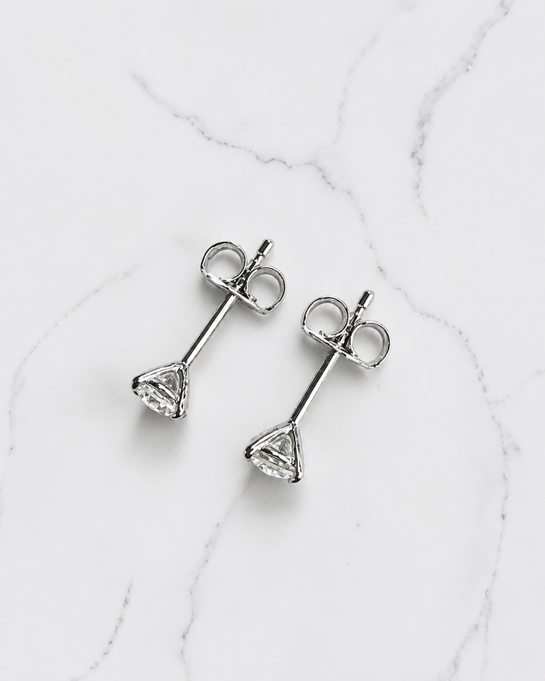 0.50ct round brilliant lab grown diamond martini stud earrings in a four prong setting handcrafted in white gold by Layla Diamonds
