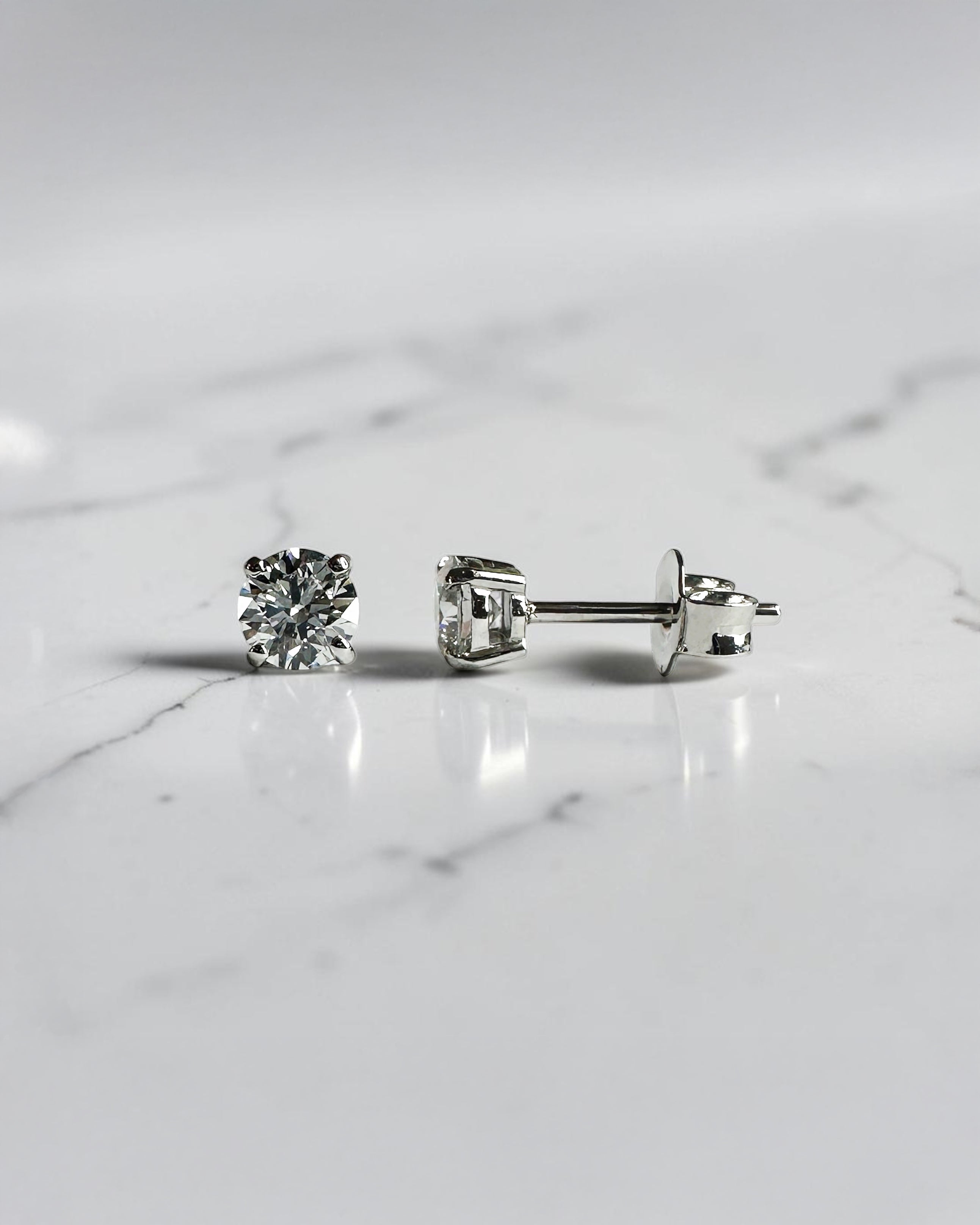 0.70ct round brilliant lab grown diamond stud earrings in a classic four prong setting handcrafted by Layla Diamonds