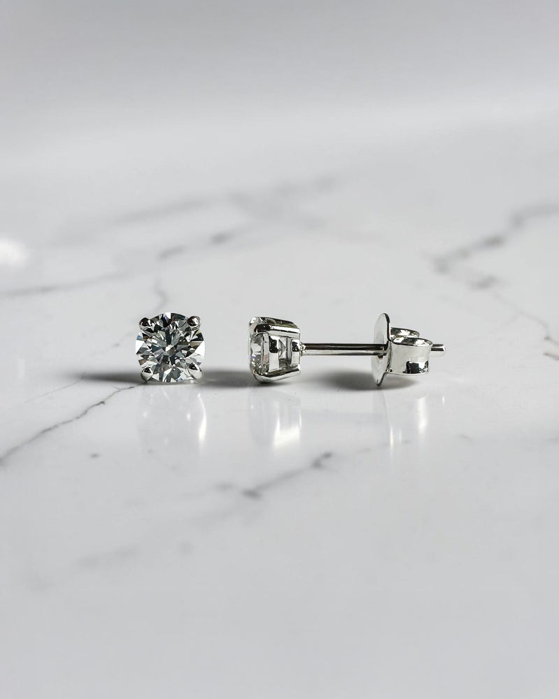0.70ct round brilliant lab grown diamond stud earrings in a classic four prong setting handcrafted by Layla Diamonds