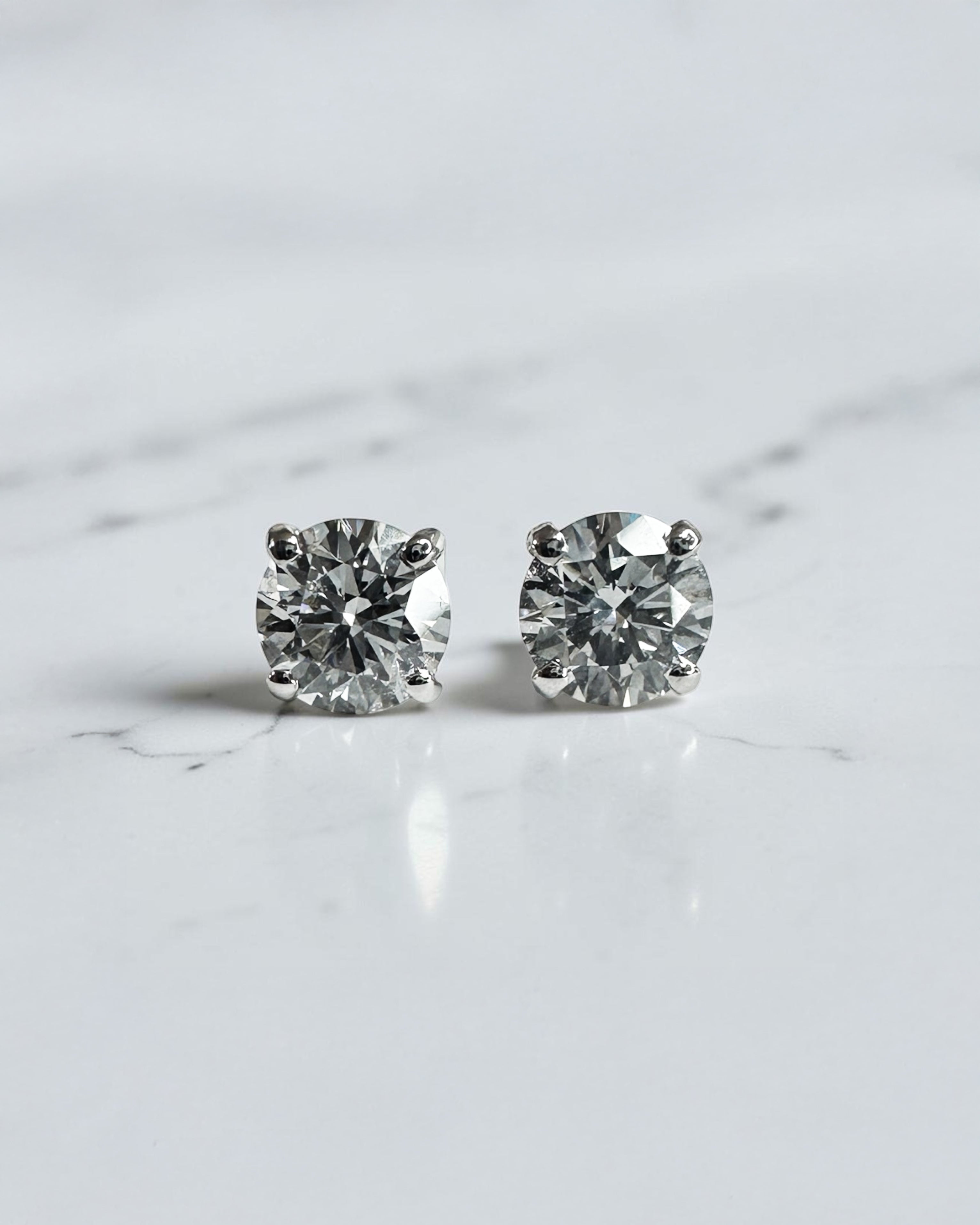 0.70ct round brilliant lab grown diamond stud earrings in a classic four prong setting handcrafted by Layla Diamonds