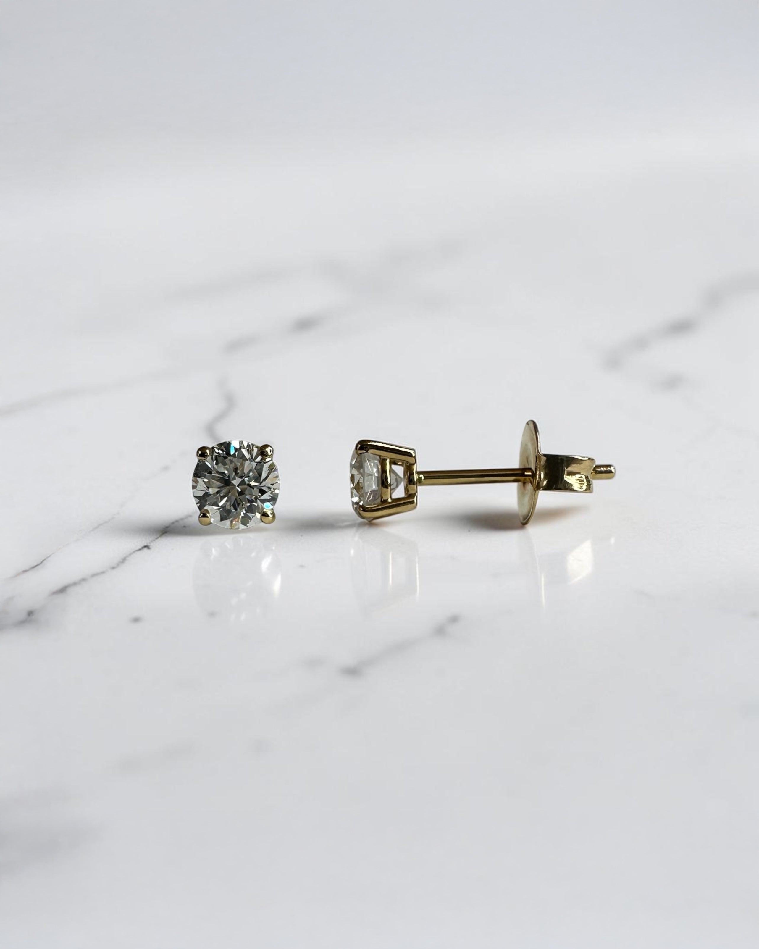 0.70ct round brilliant lab grown diamond stud earrings in a classic four prong setting handcrafted by Layla Diamonds