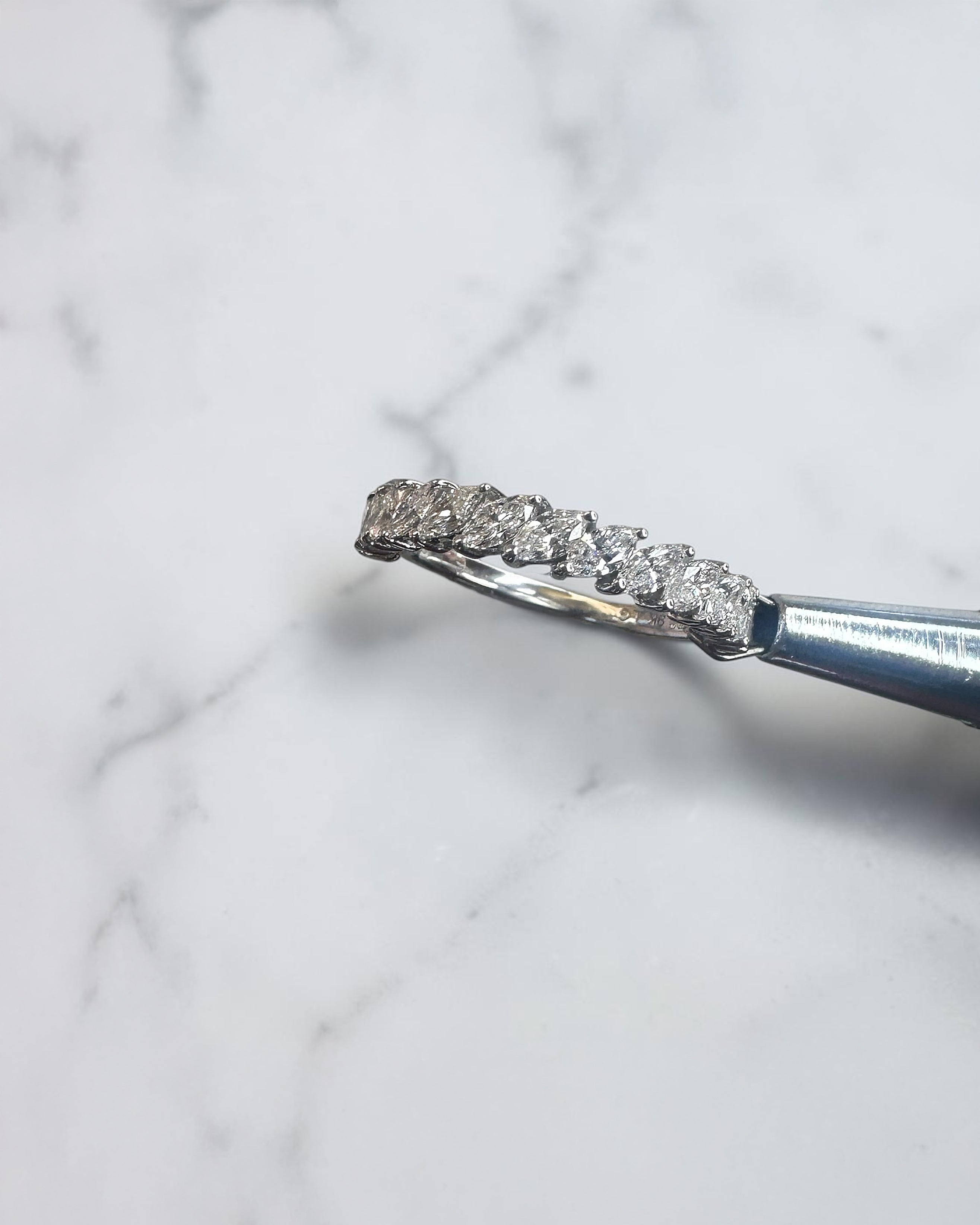 0.90ct slanted marquise cut diamond band with 0.90ct total diamonds in a claw setting, available in platinum or gold with lab grown or natural diamonds.