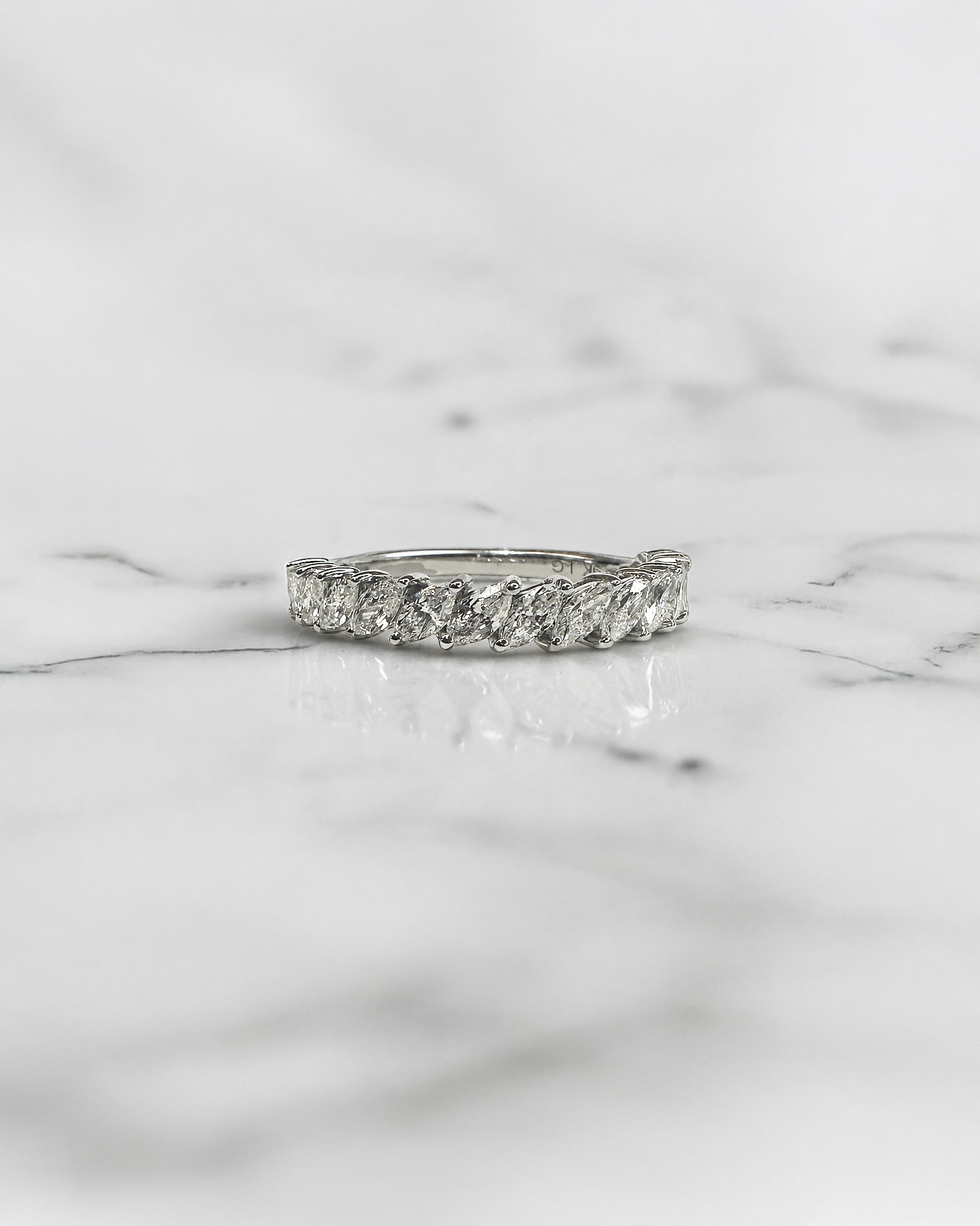 0.90ct slanted marquise cut diamond band with 0.90ct total diamonds in a claw setting, available in platinum or gold with lab grown or natural diamonds.