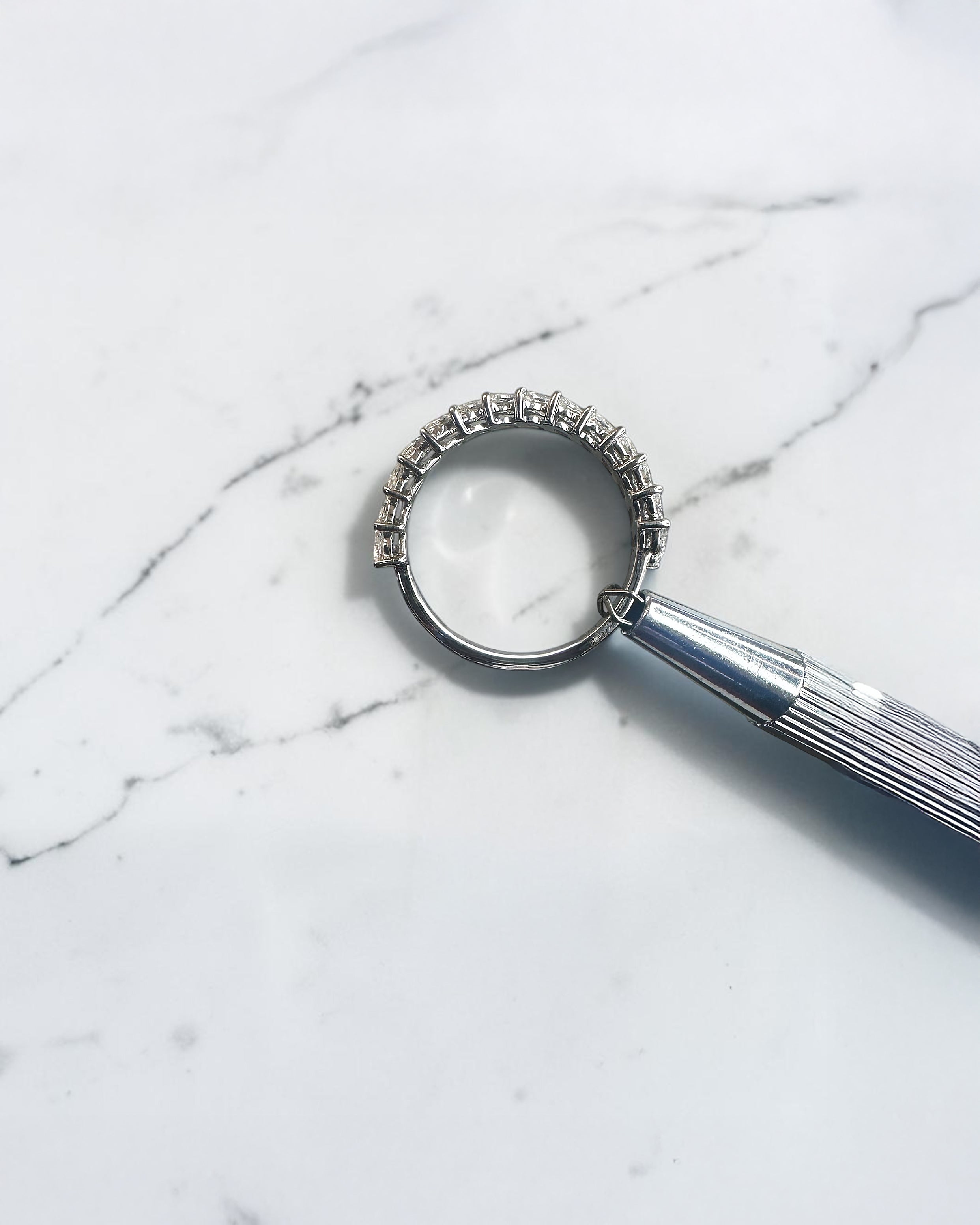 0.90ct slanted marquise cut diamond band with 0.90ct total diamonds in a claw setting, available in platinum or gold with lab grown or natural diamonds.