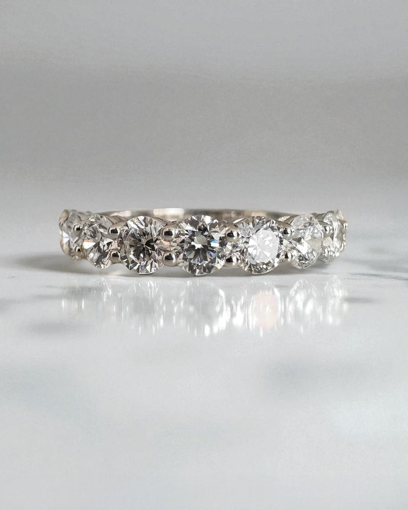 Close-up detail of the high-quality round diamonds on this elegant diamond engagement band.