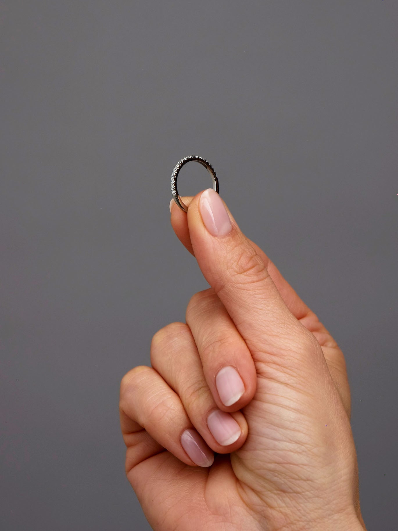 Close-up detail of the 1.5mm width on these diamond engagement bands.