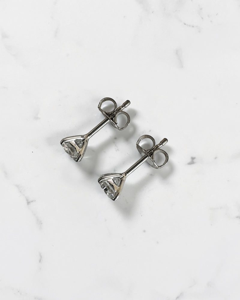 1.20ct round brilliant lab grown diamond stud earrings in a four prong martini setting with E/F colour, VS1+ clarity, available in white gold, yellow gold or platinum.