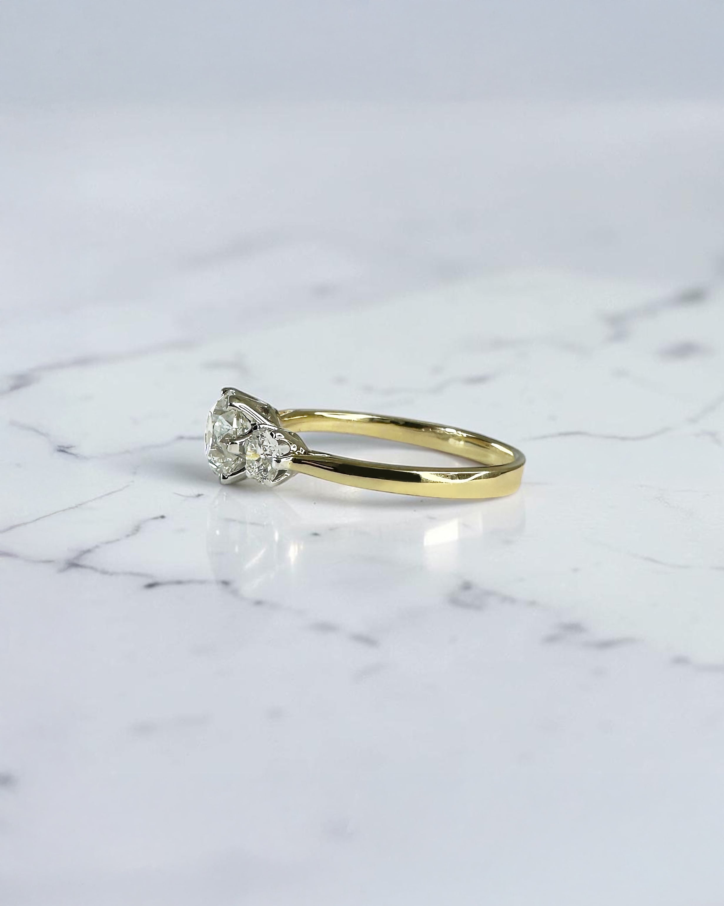 1.40ct Old Mine Cut trilogy diamond engagement ring with 1ct centre diamond, platinum setting and 18ct yellow gold band.