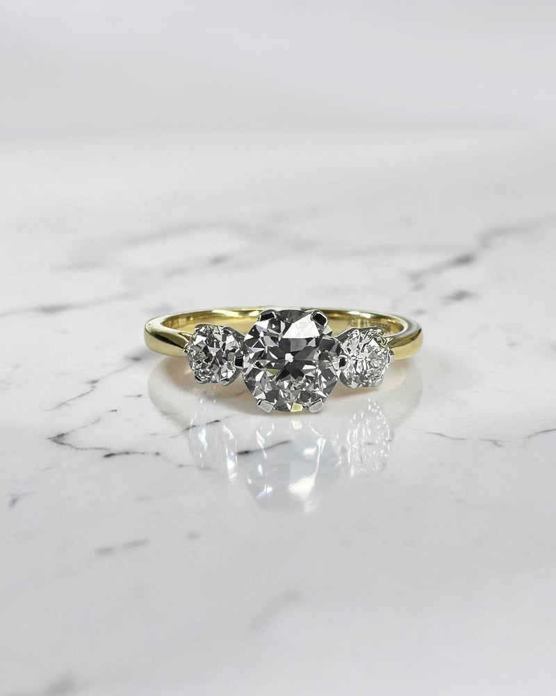 1.40ct Old Mine Cut trilogy diamond engagement ring with 1ct centre diamond, platinum setting and 18ct yellow gold band.