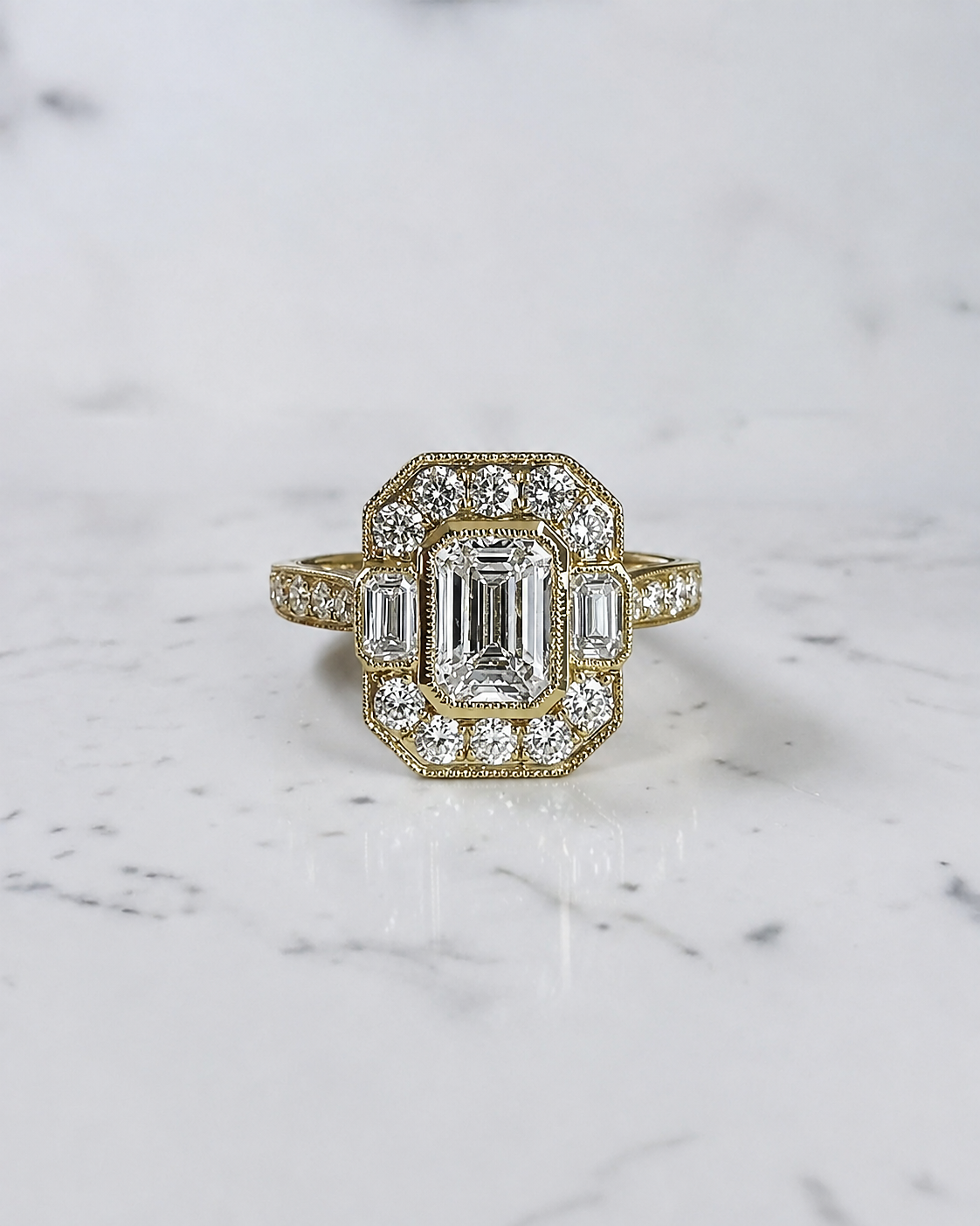 1.50ct emerald cut lab grown diamond vintage halo engagement ring with emerald cut side stones, diamond shoulders and 2.60ct total diamonds

