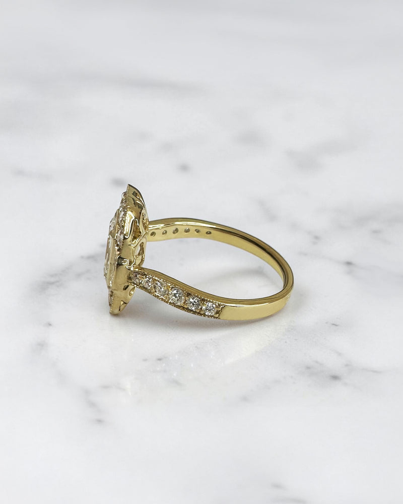 1.50ct emerald cut lab grown diamond vintage halo engagement ring with emerald cut side stones, diamond shoulders and 2.60ct total diamonds
