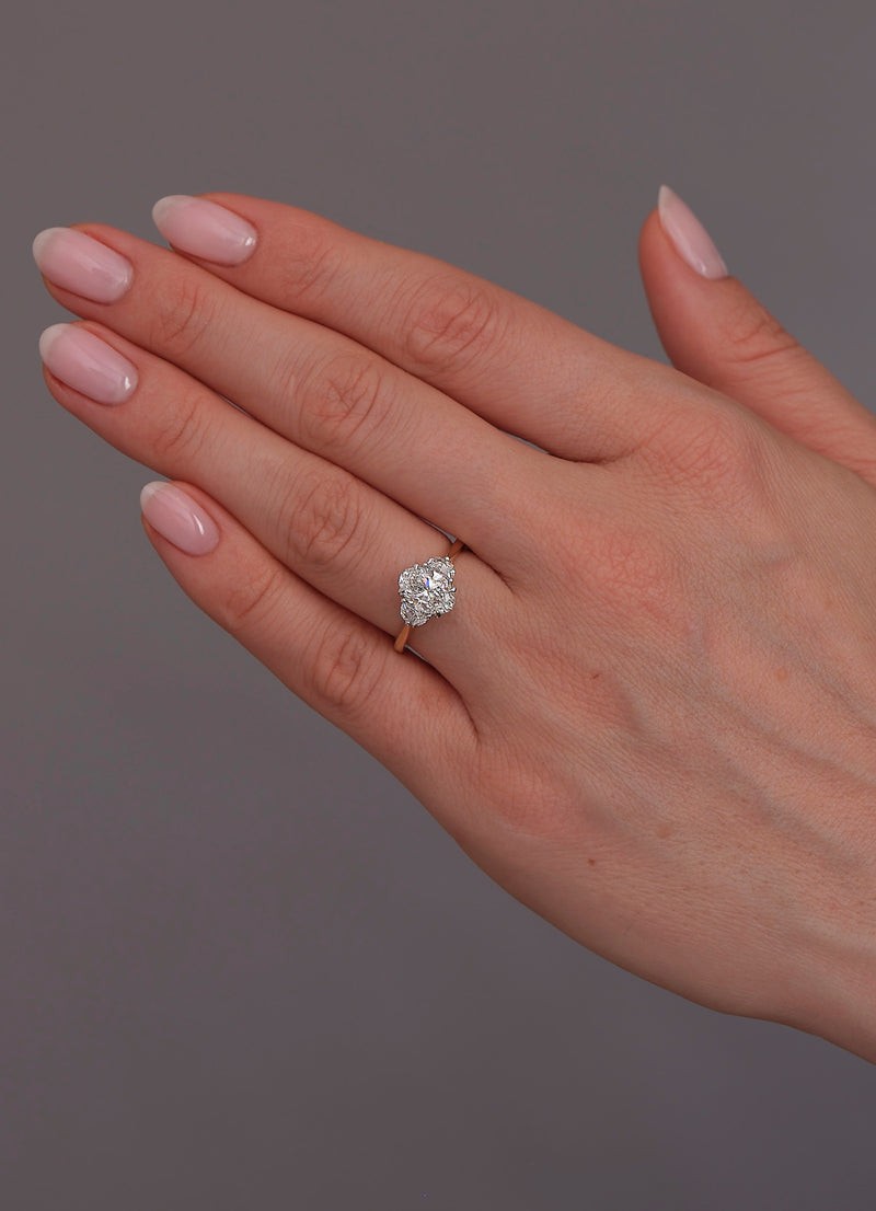 1.50ct oval cut lab grown diamond trilogy engagement ring with half moon side diamonds and platinum head by Layla Diamonds.