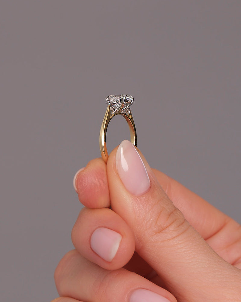 1.50ct oval cut lab grown diamond trilogy engagement ring with half moon side diamonds and platinum head by Layla Diamonds.