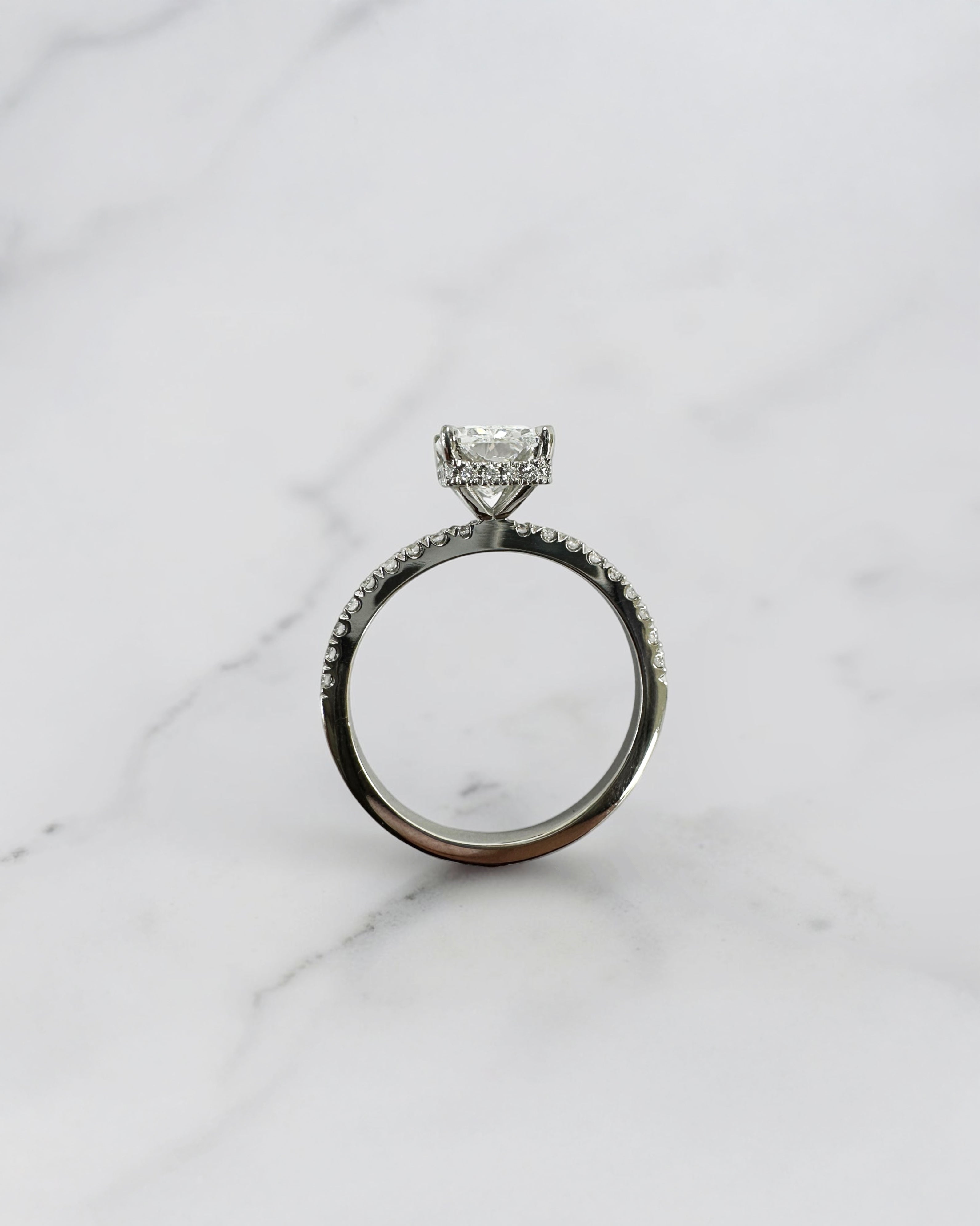 1.80ct radiant cut lab grown diamond engagement ring with diamond shoulder band and wrap around hidden halo in platinum, handmade in London by Layla Diamonds.