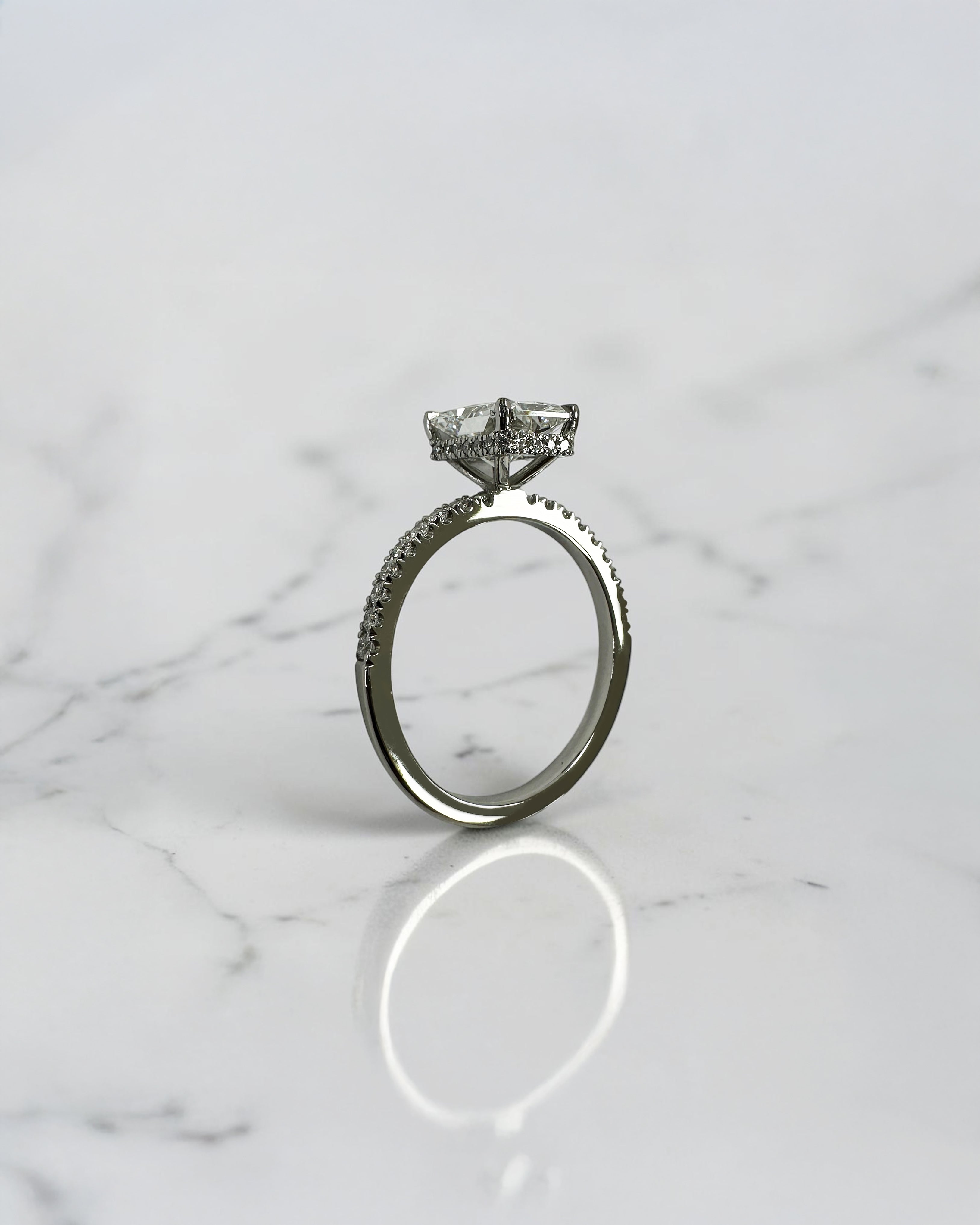 1.80ct radiant cut lab grown diamond engagement ring with diamond shoulder band and wrap around hidden halo in platinum, handmade in London by Layla Diamonds.