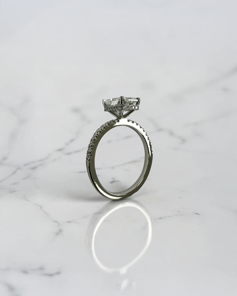 1.80ct radiant cut lab grown diamond engagement ring with diamond shoulder band and wrap around hidden halo in platinum, handmade in London by Layla Diamonds.