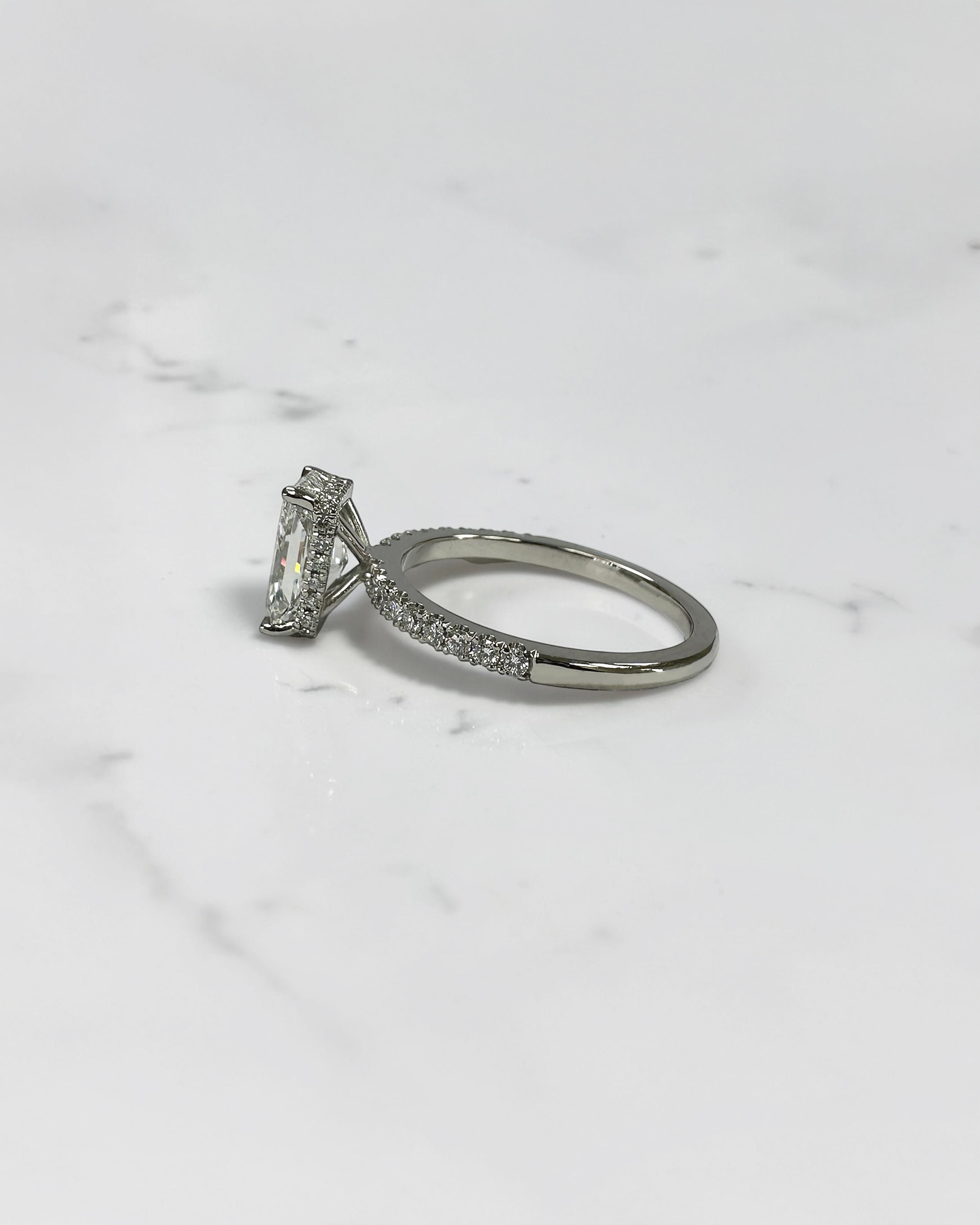 1.80ct radiant cut lab grown diamond engagement ring with diamond shoulder band and wrap around hidden halo in platinum, handmade in London by Layla Diamonds.