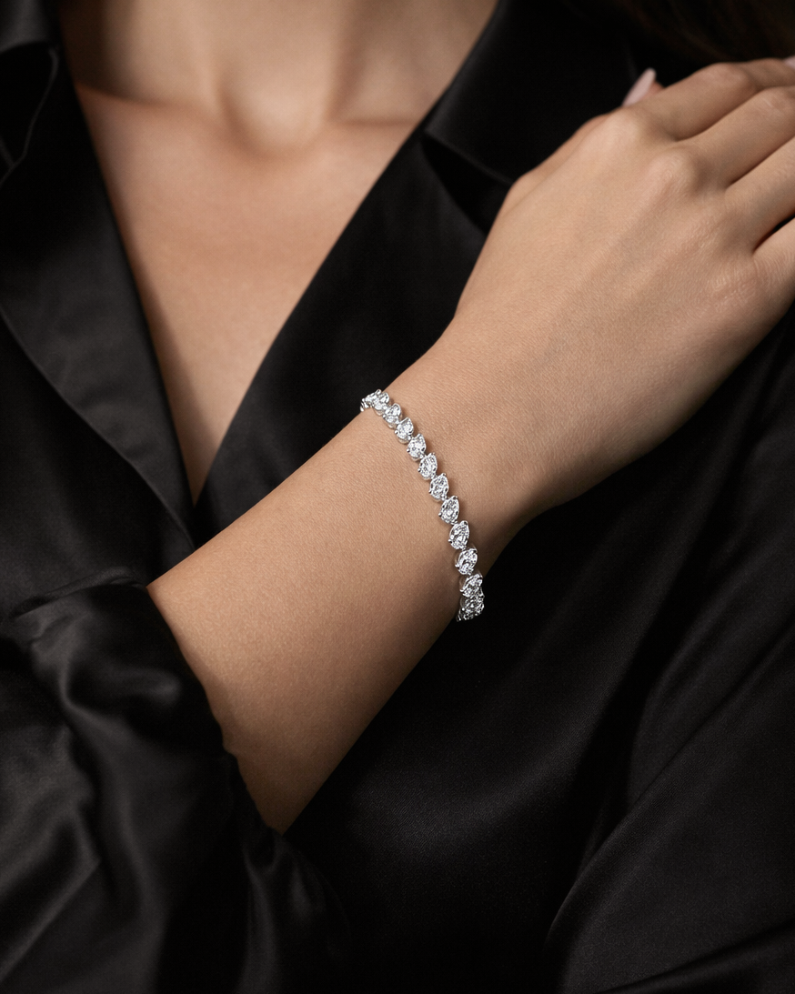 10ct Slanted Pear Cut Lab Grown Diamond Tennis Bracelet 9kt or 18kt white gold on wrist shown worn