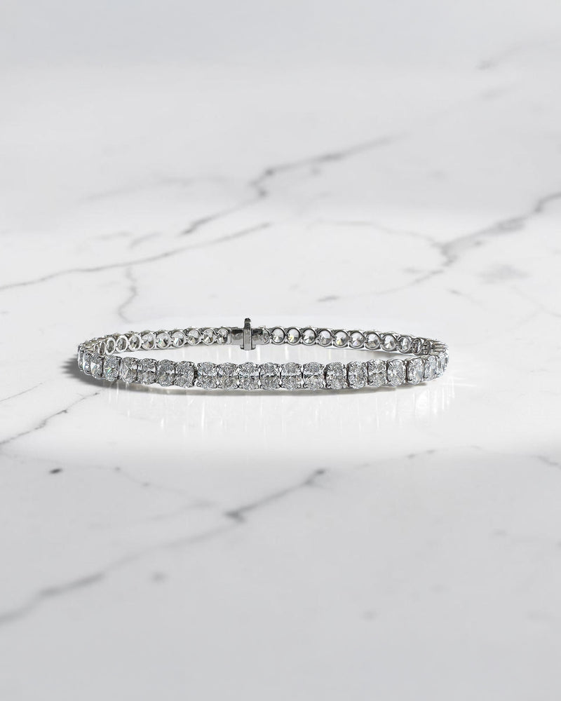 10ct oval cut diamond tennis bracelet in white gold featuring approximately 10 carats of oval diamonds with a 4.80mm width, available in lab grown or natural diamonds.