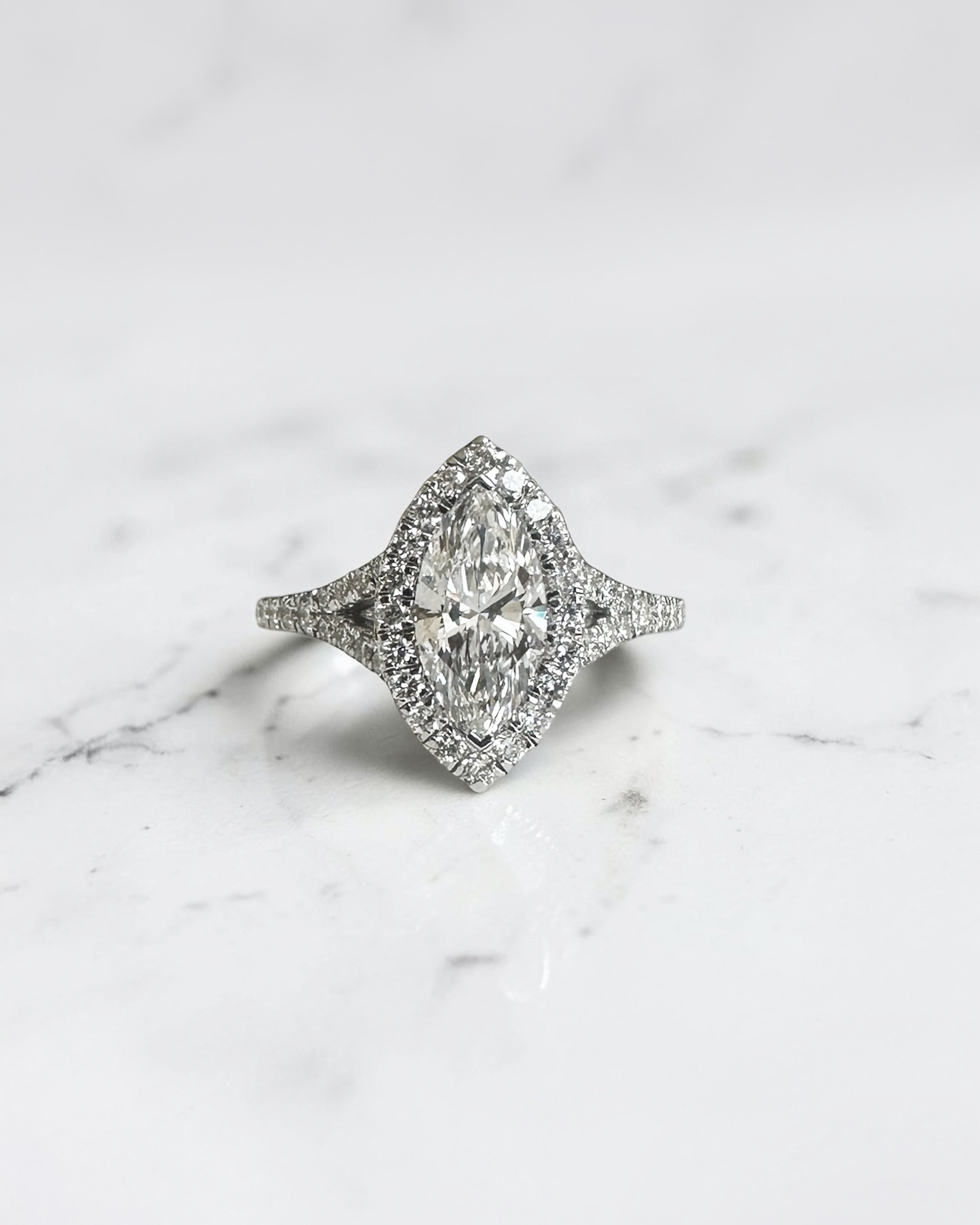 1ct marquise cut lab grown diamond halo engagement ring with diamond set split shoulders in white gold

