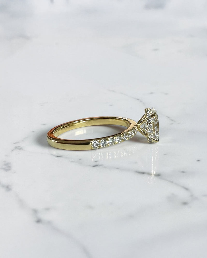 1ct oval cut lab grown diamond engagement ring with wrap around hidden halo and diamond shoulder band
