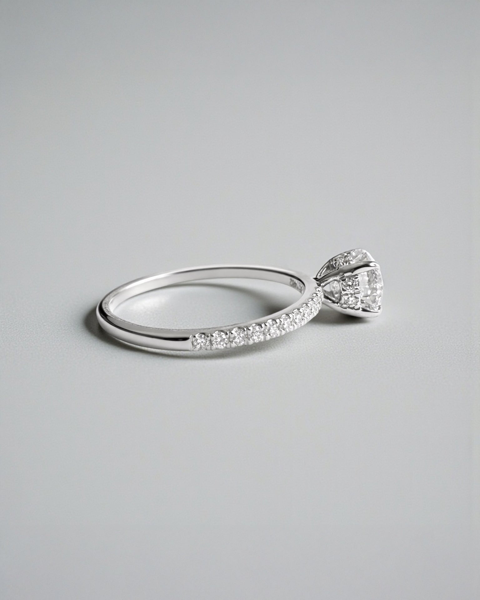1ct Round brilliant lab grown diamond ring with pavé diamond shoulders, luxury engagement ring